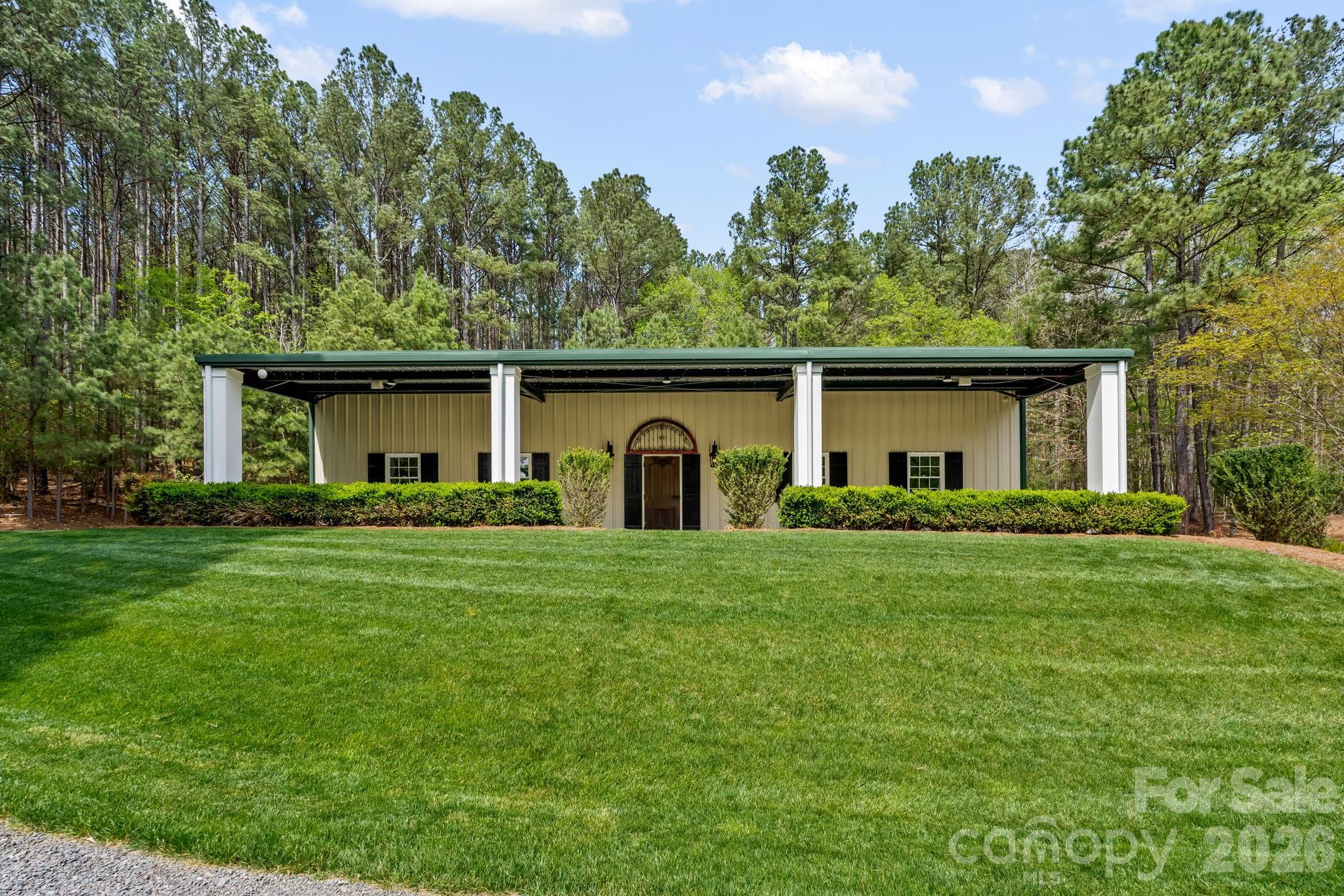 60x40 insulated building with covered patio overlooks the pond - 11555 Double Spring Road, Lewisville