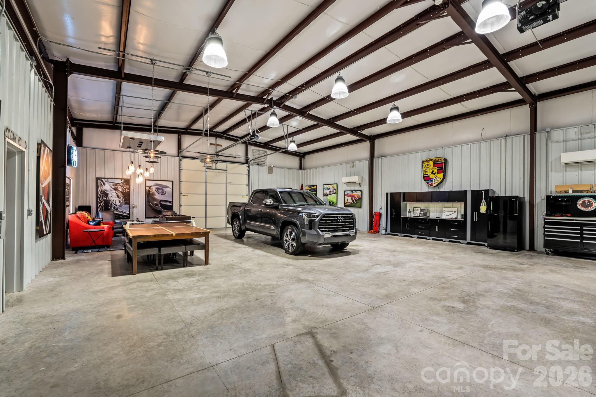 Heated and cooled by dual mini splits, LED lighting, Sonos sound system, alarm, bathroom, garage bays, and separate septic system - 11555 Double Spring Road, Lewisville