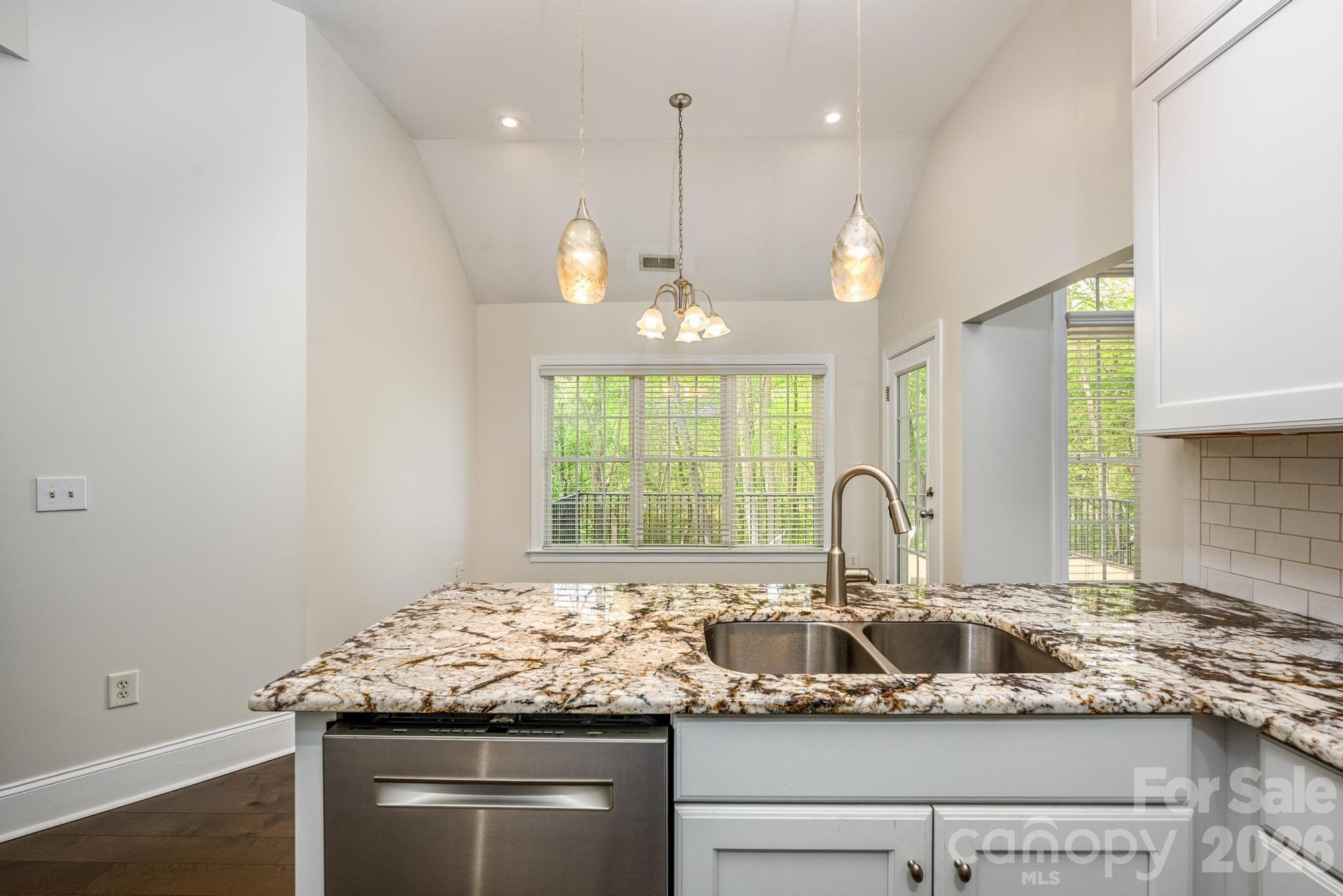 Kitchen Overlooking Breakfast Area - 7867 Golf Course Drive N, Denver