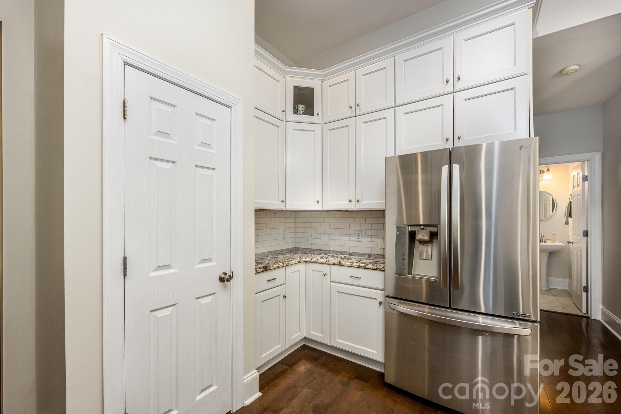 Kitchen w/Custom Cabinets & Pantry - 7867 Golf Course Drive N, Denver