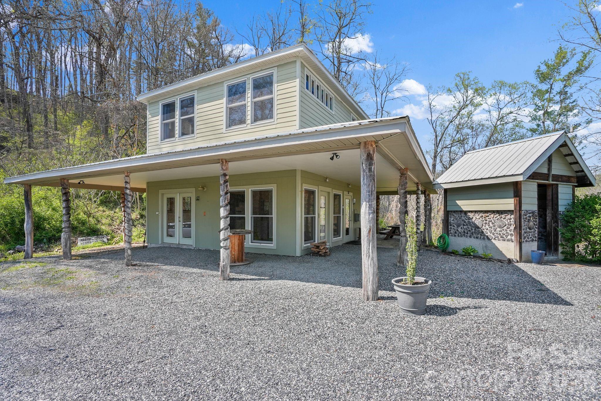 Carriage house and adjacent cord wood pump house - 310 Burr Ridge, Marshall