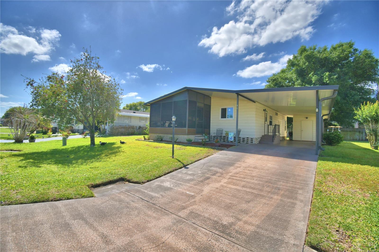 Manufactured Home at 447 VILLAGE CIR SW, WINTER HAVEN, photo 3 of 48