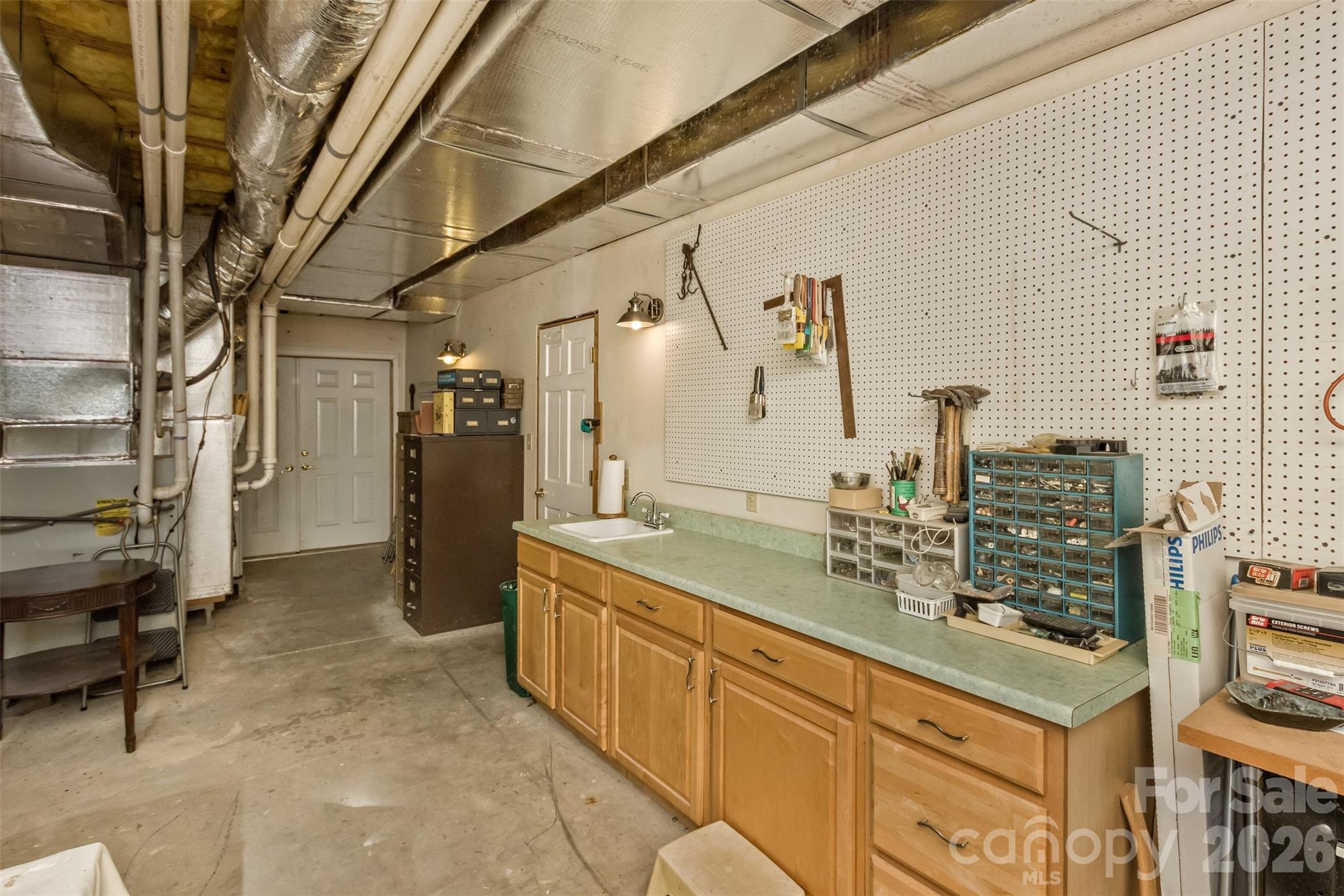Work Shop off Garage with Sink - 25 Windsong Drive, Fairview