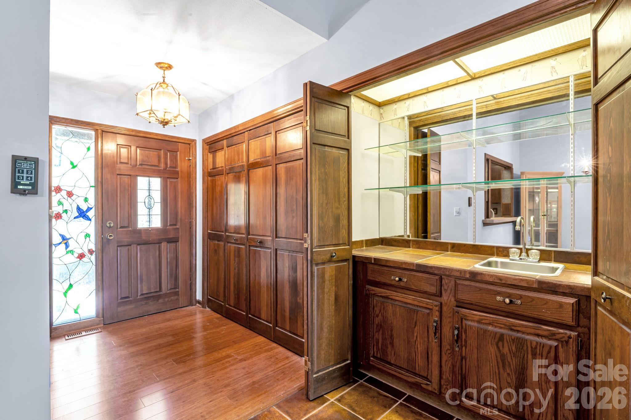 Main-level wet bar—perfect for entertaining and hosting guests with ease. - 3104 Cove Loop Road, Hendersonville