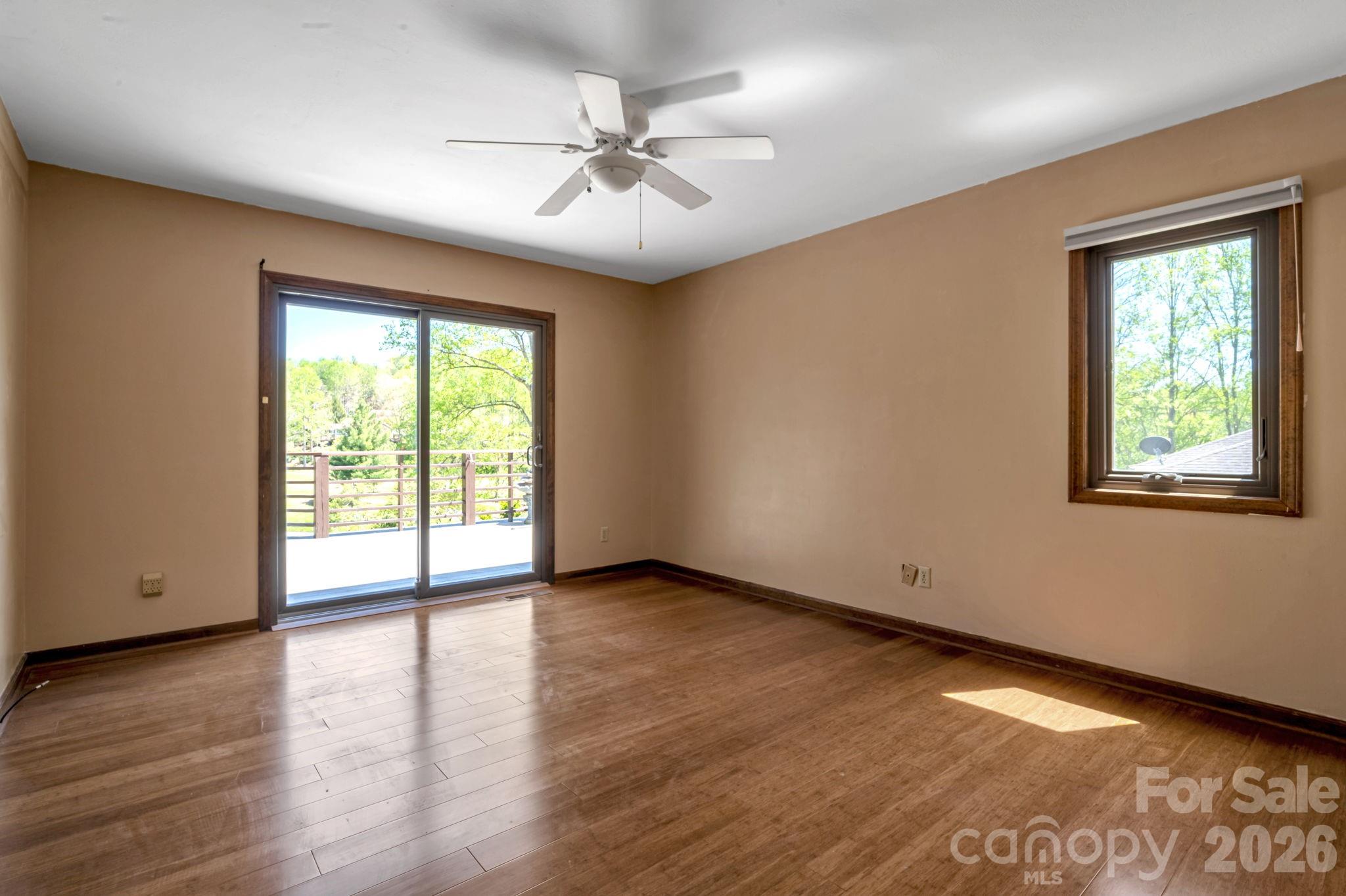 Bedroom filled with natural light - 3104 Cove Loop Road, Hendersonville