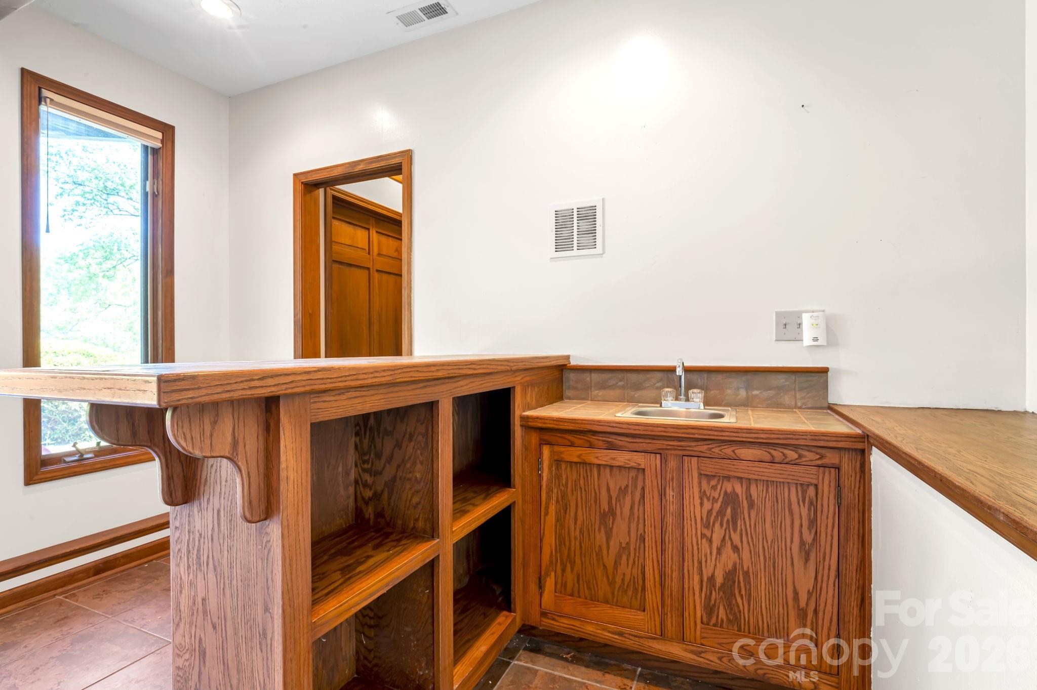 Downstairs wet bar perfectly positioned for gatherings - 3104 Cove Loop Road, Hendersonville