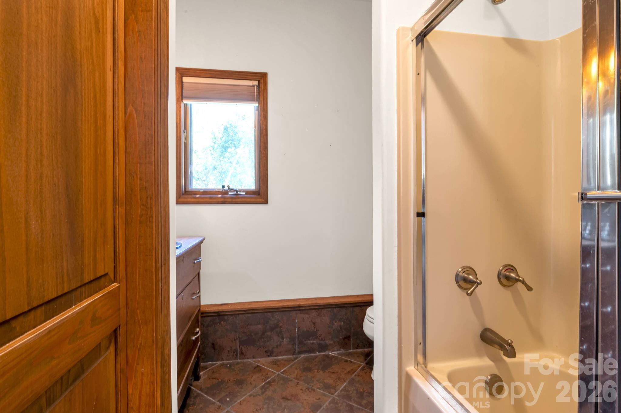 Third full bathroom serving the lower level - 3104 Cove Loop Road, Hendersonville