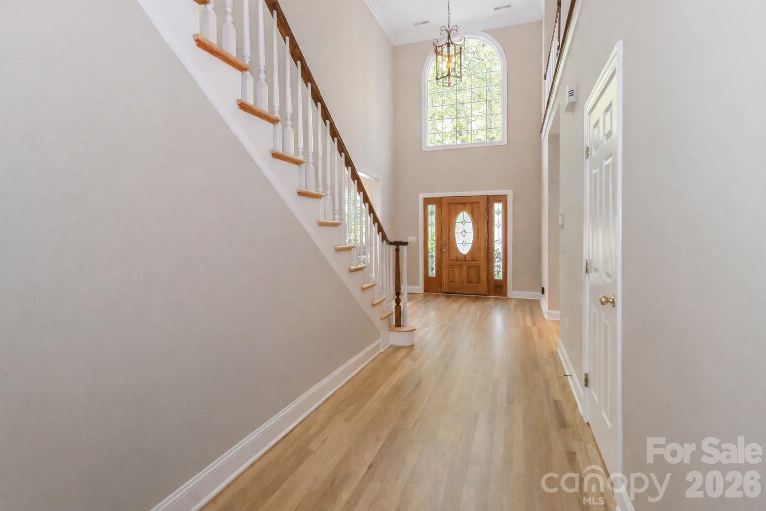 Foyer with beautiful hardwood floors and high ceilings - 119 Shelter Cove Lane, Mooresville