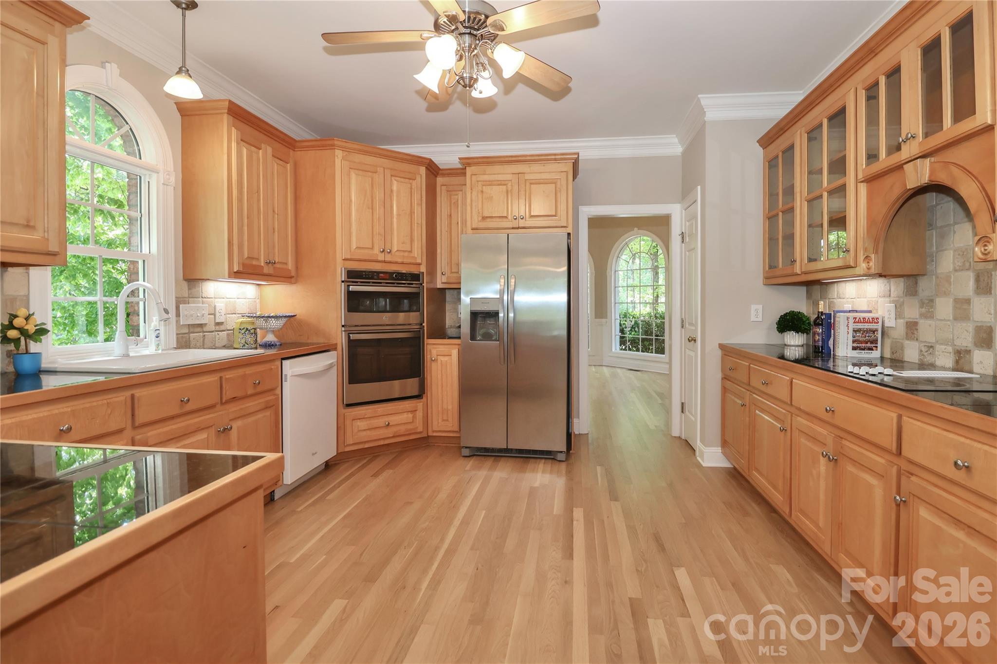 Kitchen with newly finished hardwood floors - 119 Shelter Cove Lane, Mooresville