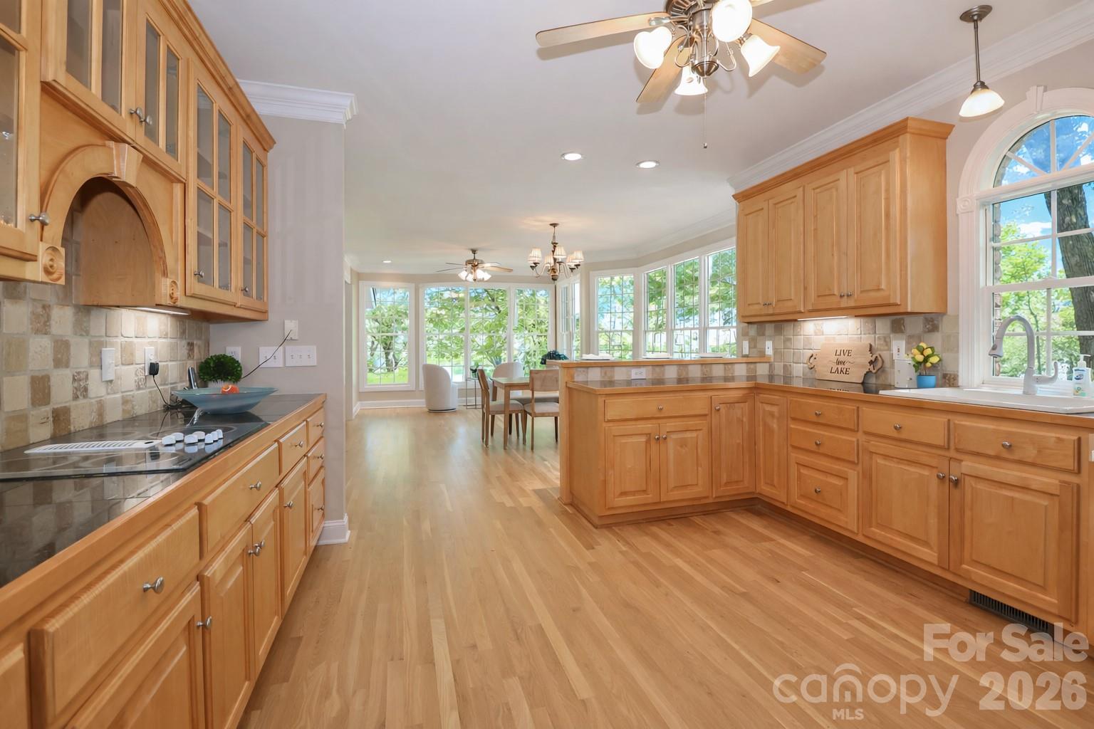 Kitchen with captivating views of the lake - 119 Shelter Cove Lane, Mooresville