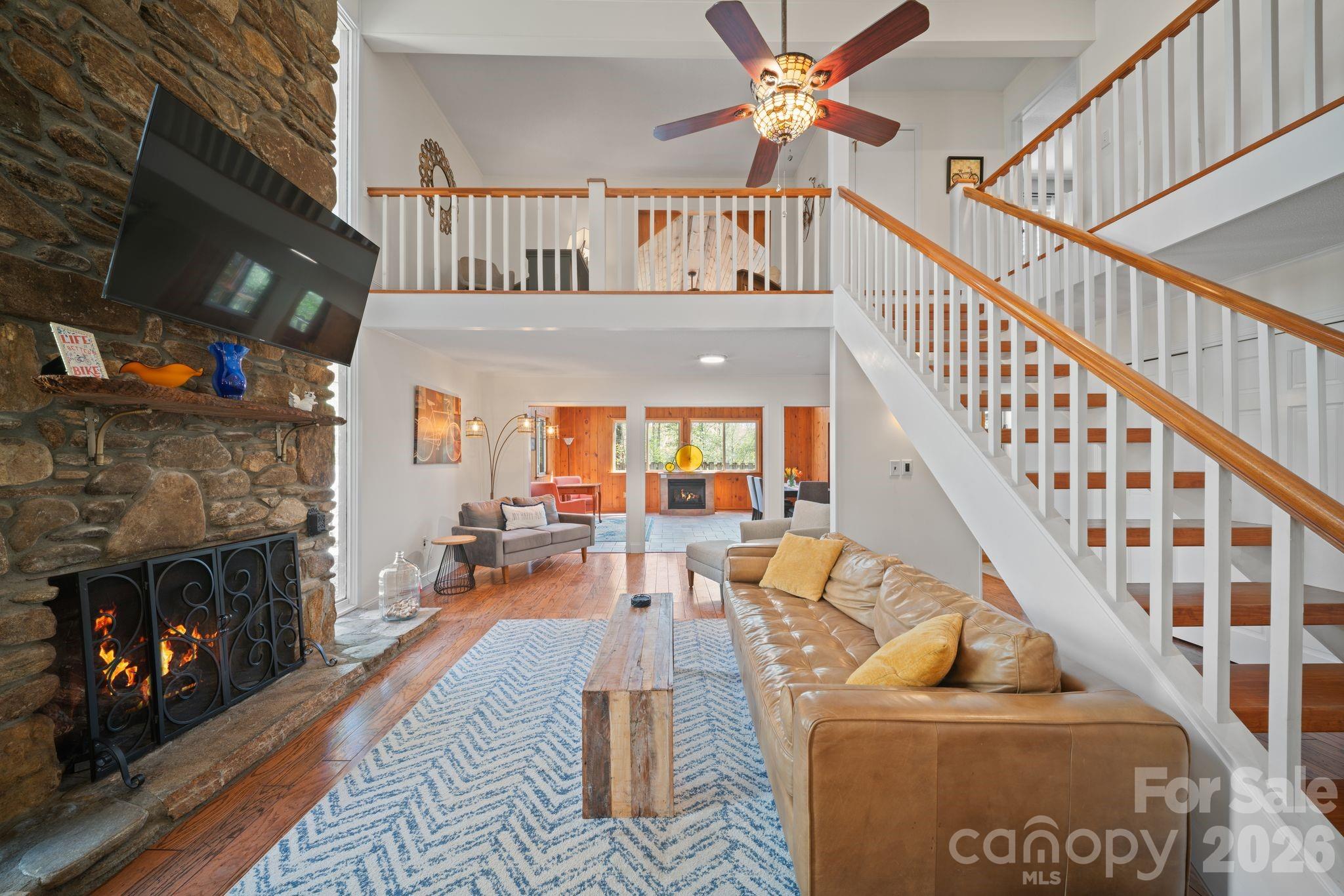 Sit in front of the gorgeous floor to ceiling rock fireplace - 363 S Sequoyah Lane, Brevard