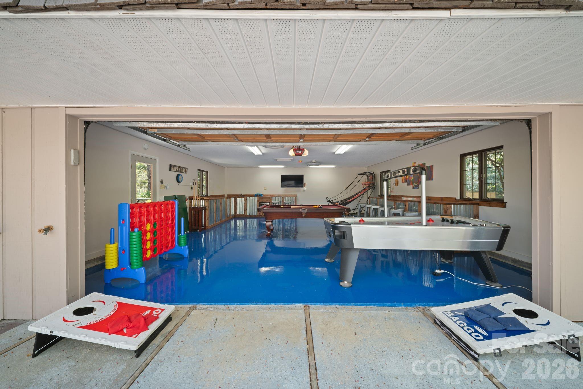Speaking of garage! This one has been transformed into a game room/entertainment hub - 363 S Sequoyah Lane, Brevard