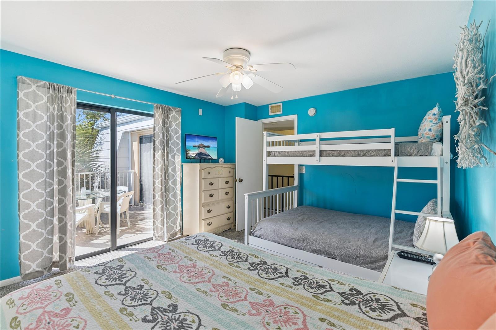 Second Bedroom with Sliding Glass Doors to Balcony - 4150 S ATLANTIC AVE #121B, NEW SMYRNA BEACH