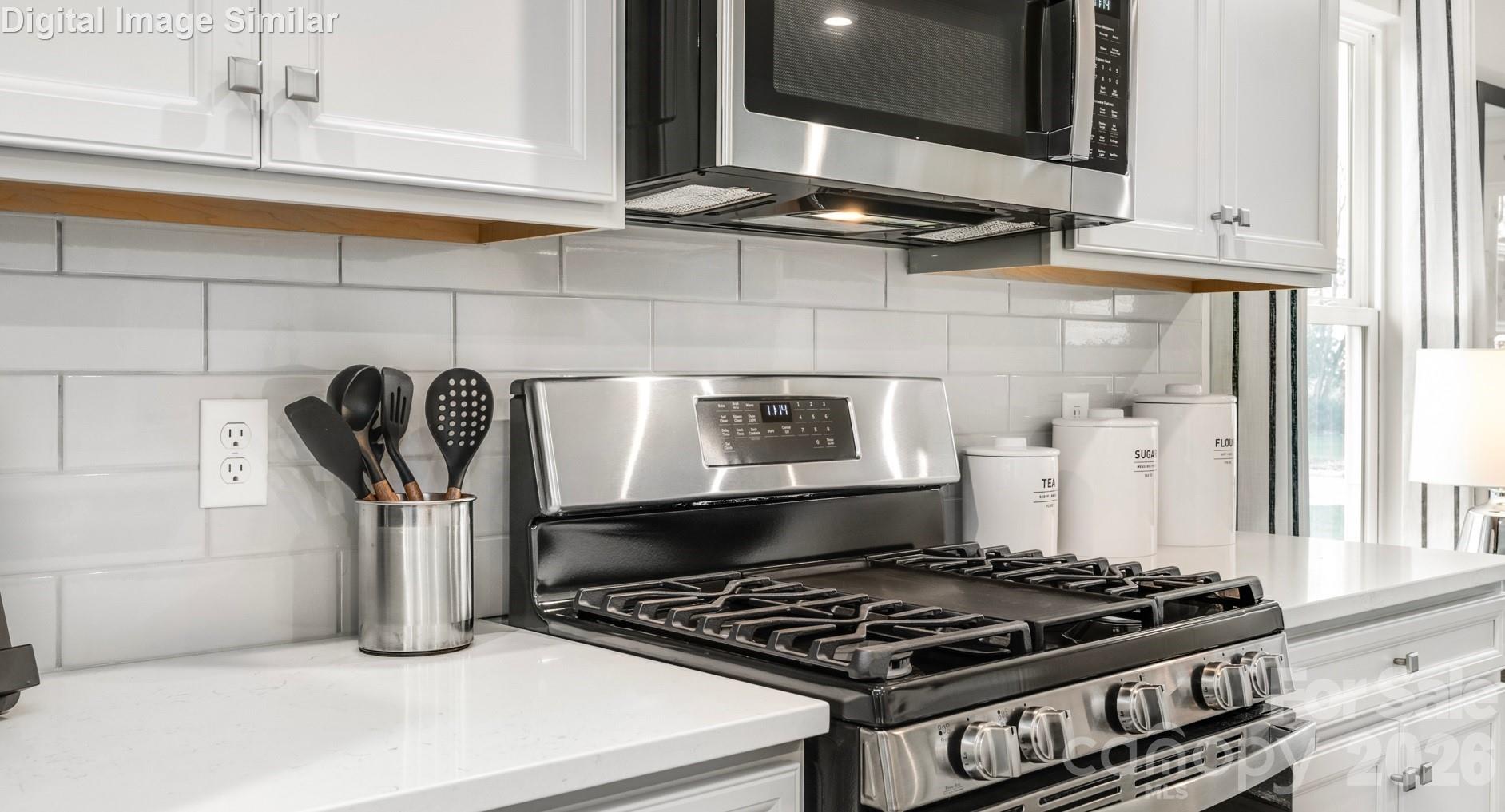If the kitchen is the soul of the home, this one is bursting with character and functionality. At its center is a gas stove (optional) —a favorite among culinary enthusiasts for its precision and instant heat control. - 3271 Eller Drive Extension, Hickory