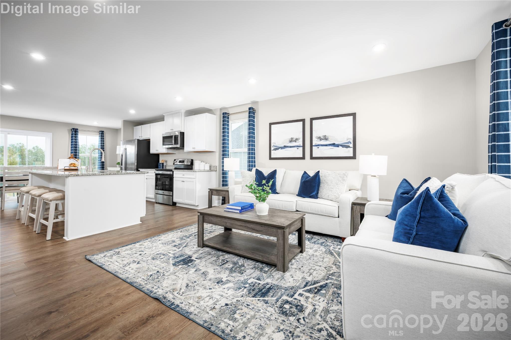 The open floor plan connects the kitchen to the living and dining areas, creating a natural flow that’s perfect for entertaining or keeping an eye on the kids while you cook. It’s a space that invites conversation, connection, and plenty of culinary creativity. - 3271 Eller Drive Extension, Hickory