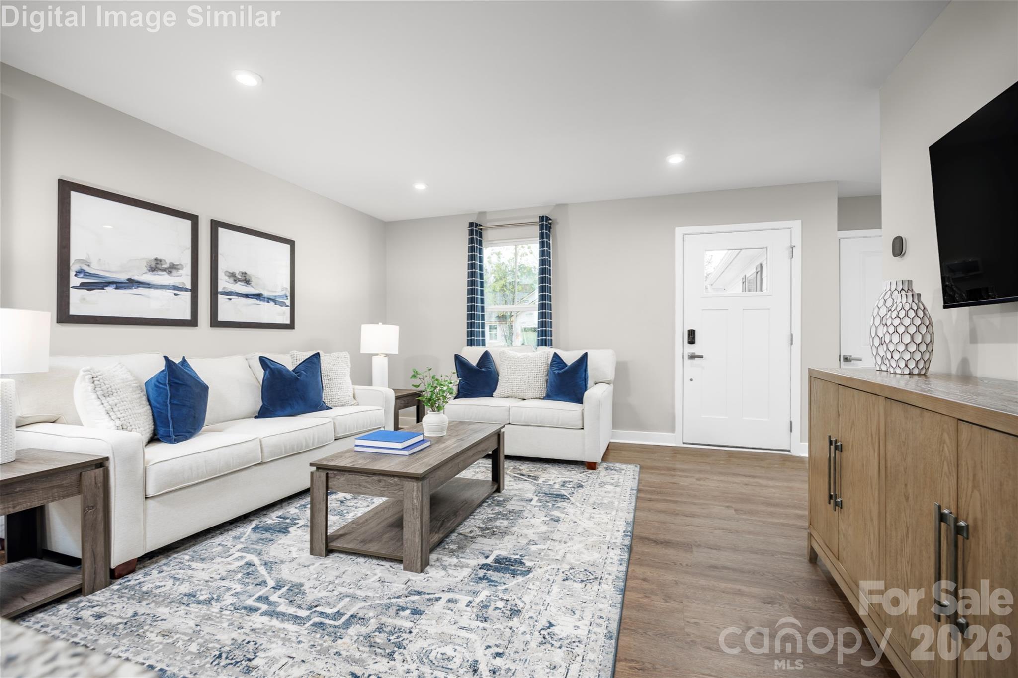 Step through the front entrance and you’re immediately greeted by a sense of openness and warmth. This great room is more than just a living space—it’s a statement. - 3271 Eller Drive Extension, Hickory