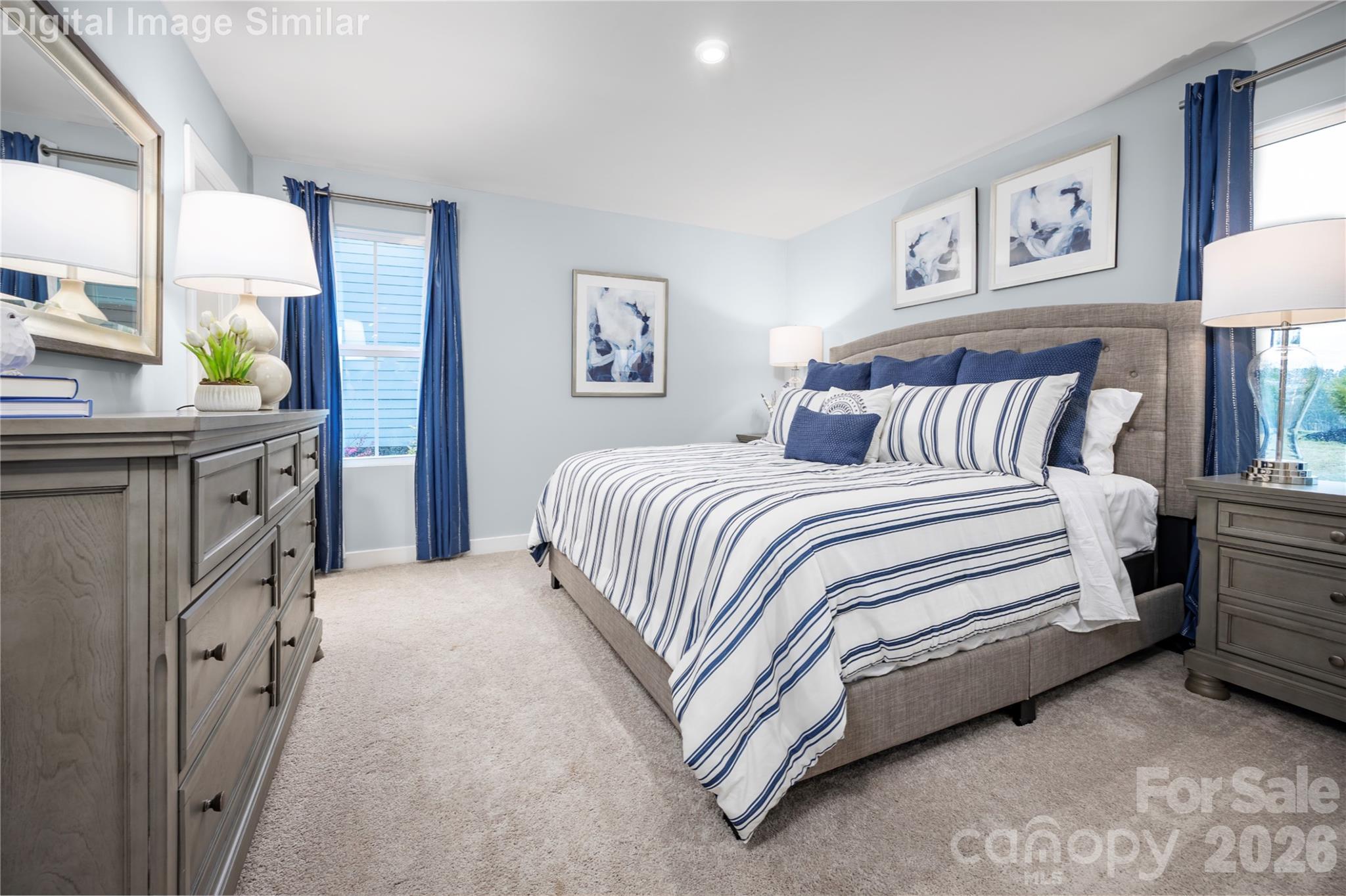 Framed by two wide windows, this serene retreat is bathed in natural light, creating a warm and peaceful ambiance from sunrise to sunset. - 3271 Eller Drive Extension, Hickory