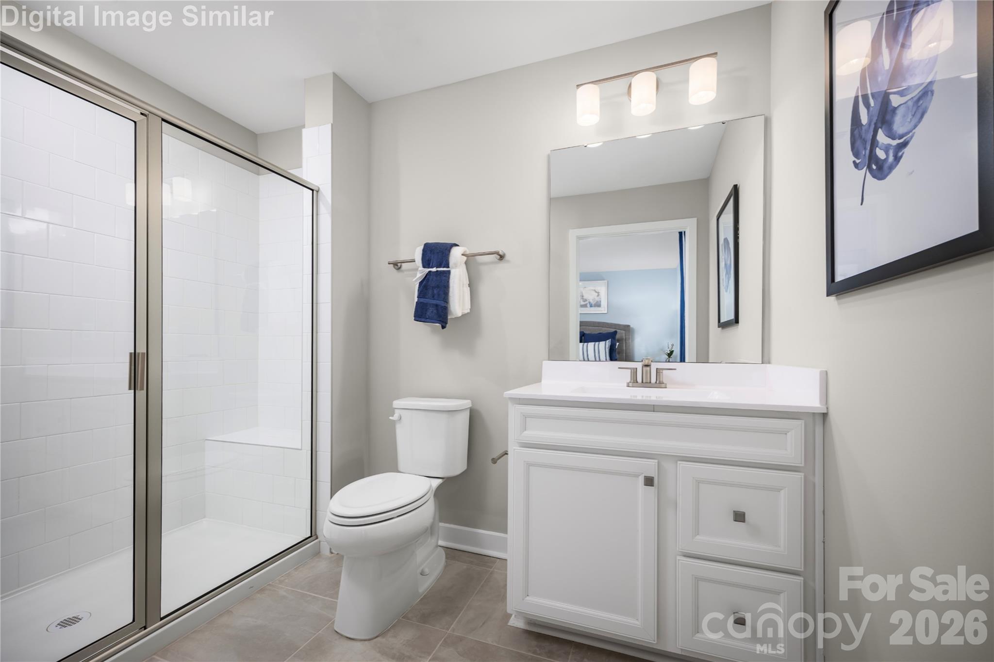 Clean lines and smart design create a space that's both spacious and soothing. The standout feature - a framed shower door that adds a touch of sophistication while keeping the space feeling open and airy. - 3271 Eller Drive Extension, Hickory
