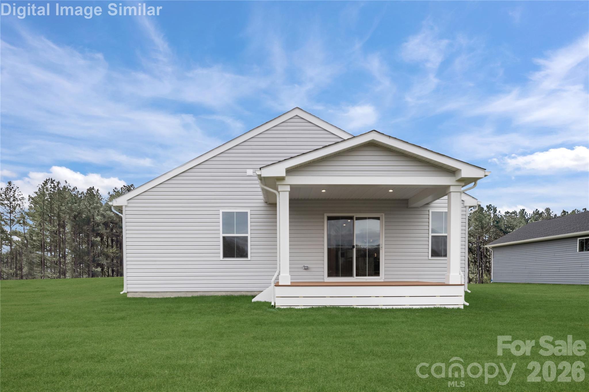 There's something timeless about a covered porch - a space that invites you to slow down, sip something warm, and watch the world go by. - 3271 Eller Drive Extension, Hickory
