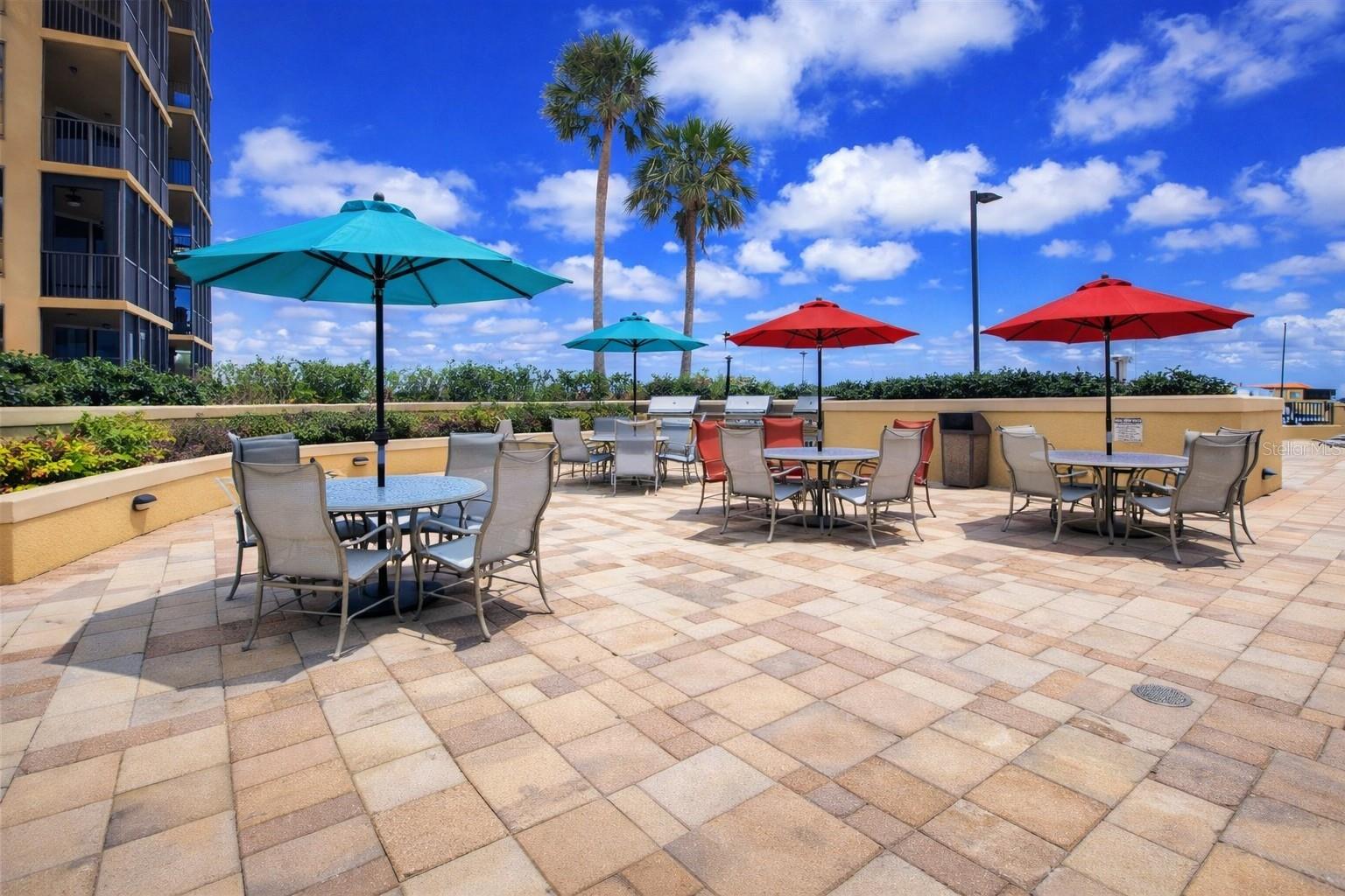 The pool deck has sunning dining and grilling areas, also easy access to the fitness center, and restrooms. - 3321 SUNSET KEY CIR #502, PUNTA GORDA