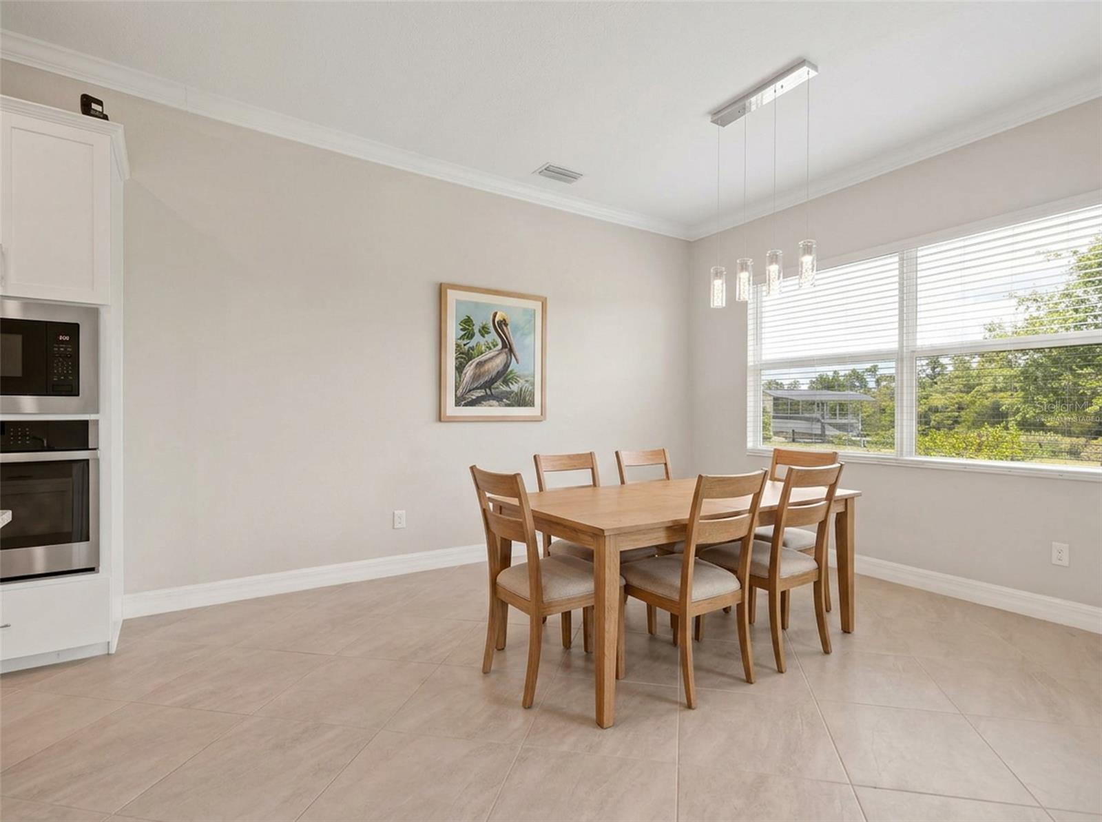 Ai Virtually staged dinging room. - 14500 PONCE DE LEON TRL, PORT CHARLOTTE