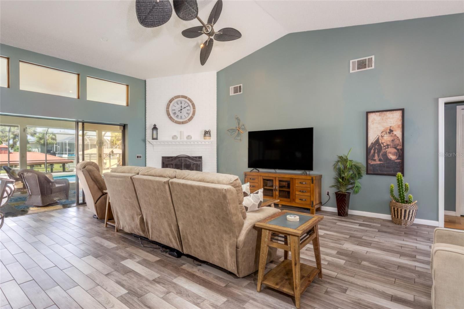 Living room with 3 sliders that ead to Screened in Lanai. - 18 CLASSIC CT S, PALM COAST