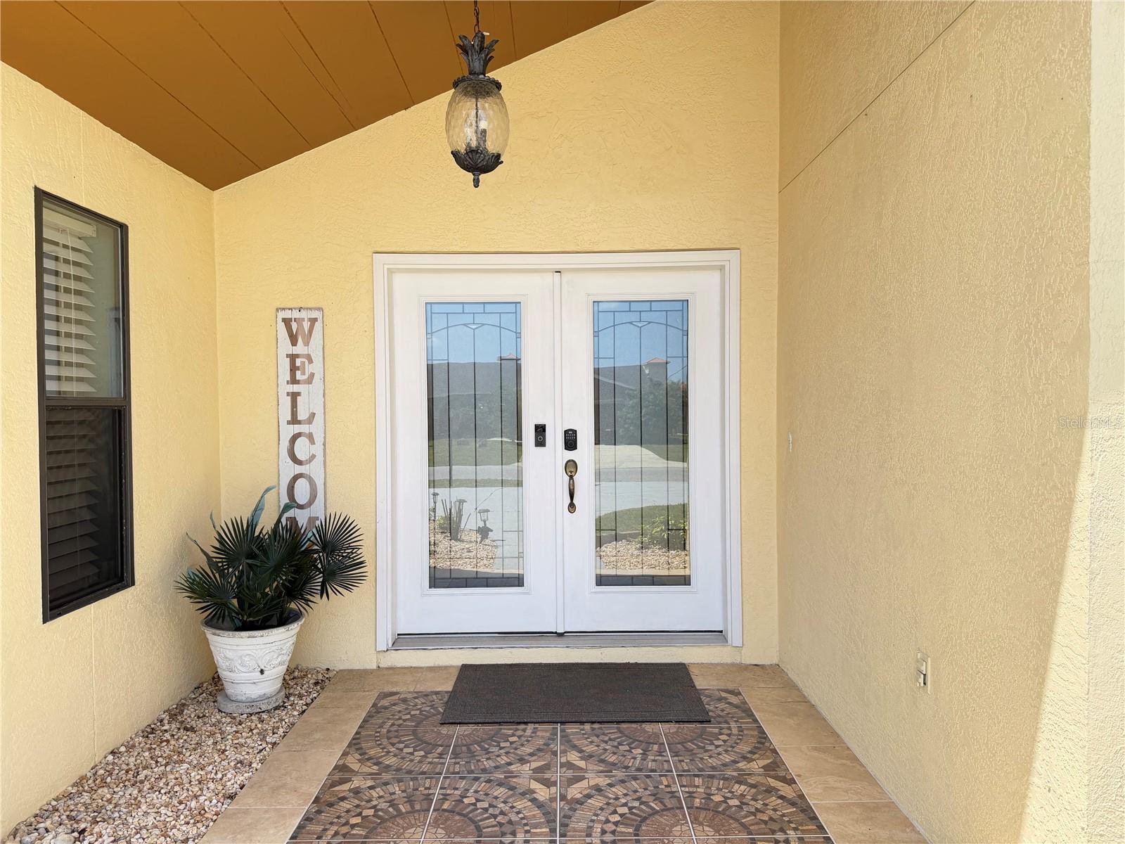 Covered front entry. - 18 CLASSIC CT S, PALM COAST