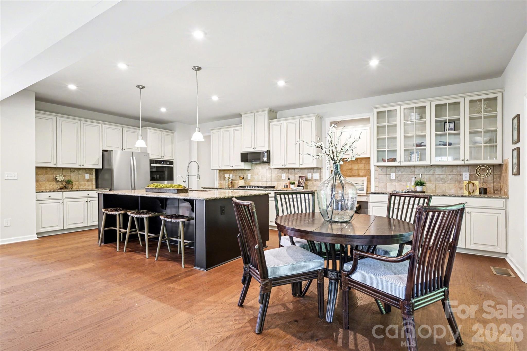 Lots of space to gather in the kitchen as well as an additional sitting area to enjoy meals. - 824 Abbeywood Drive, Waxhaw