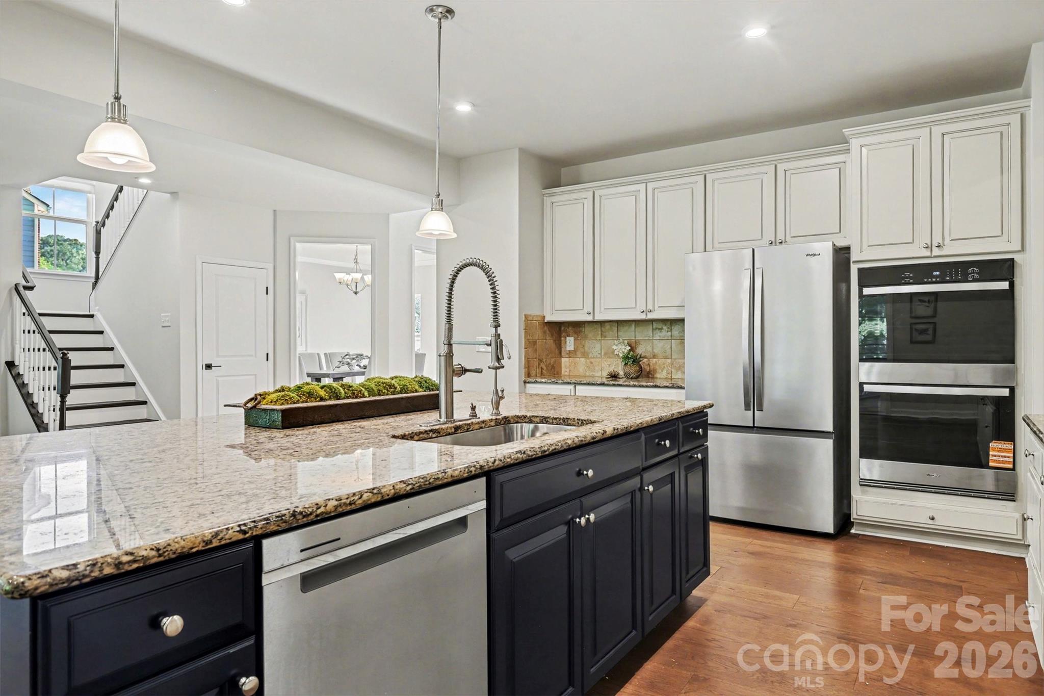 The Double oven and Whirlpool refrigerator are must-haves when hosting large gatherings. - 824 Abbeywood Drive, Waxhaw