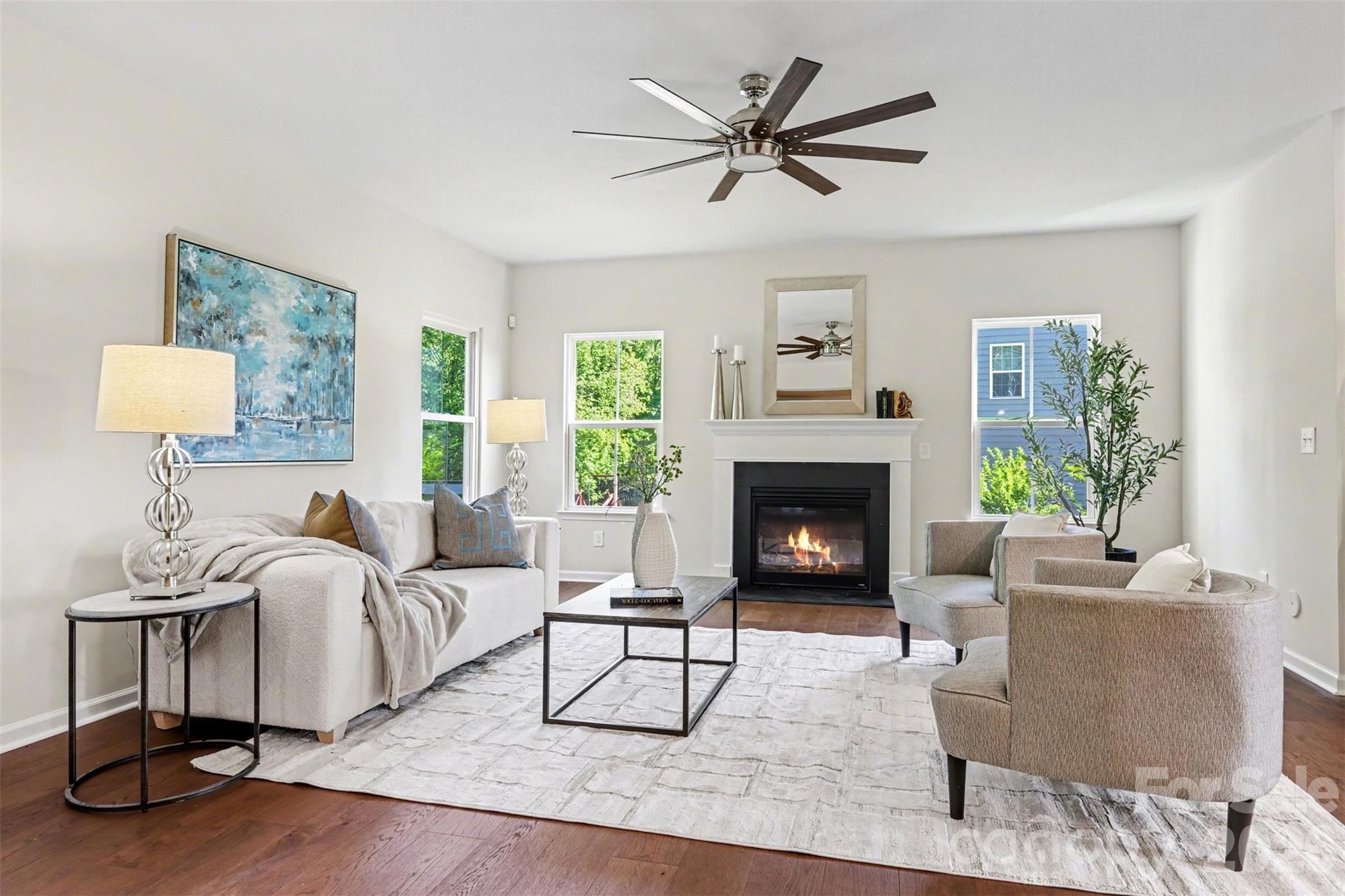 Enjoy a cozy gas fireplace when desired and display your favorite art or a large flat-screen over the mantel! - 824 Abbeywood Drive, Waxhaw