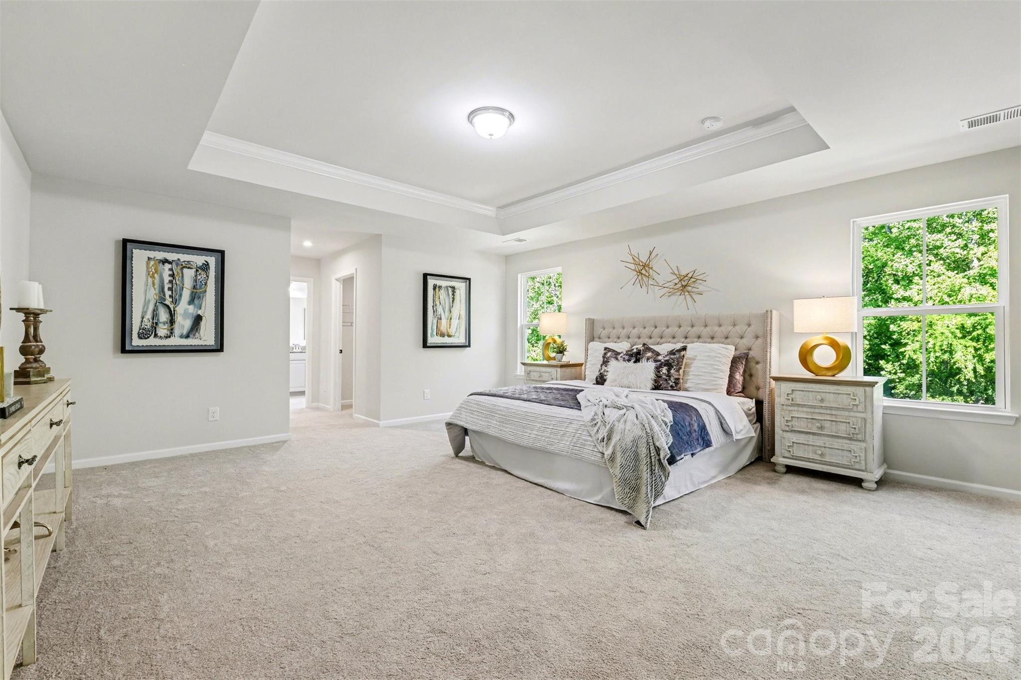 Spacious upper level Owner Suite featuring tray ceiling. - 824 Abbeywood Drive, Waxhaw