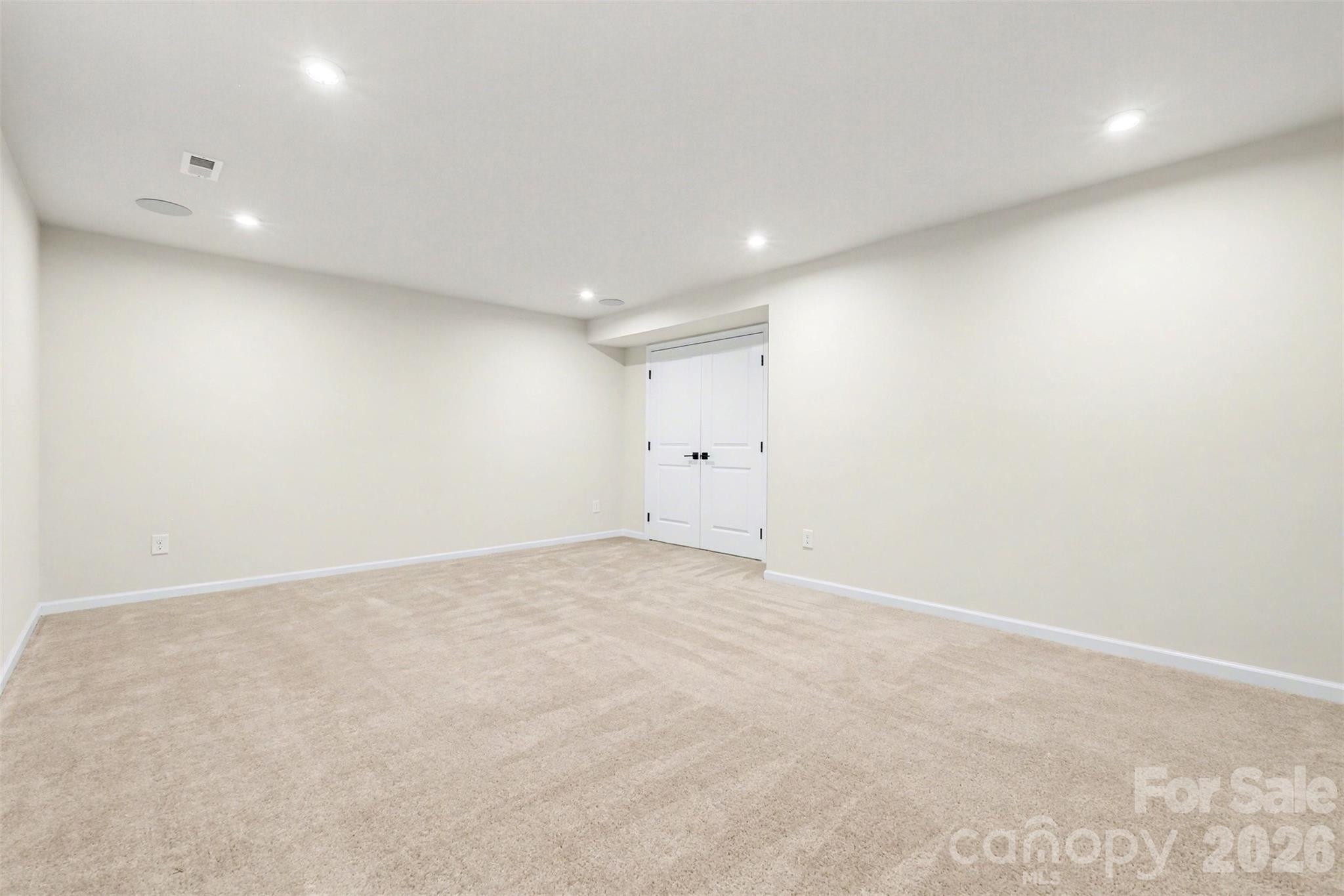 The lower level media room offers a private, enclosed space for films, music or additional entertaining. - 824 Abbeywood Drive, Waxhaw