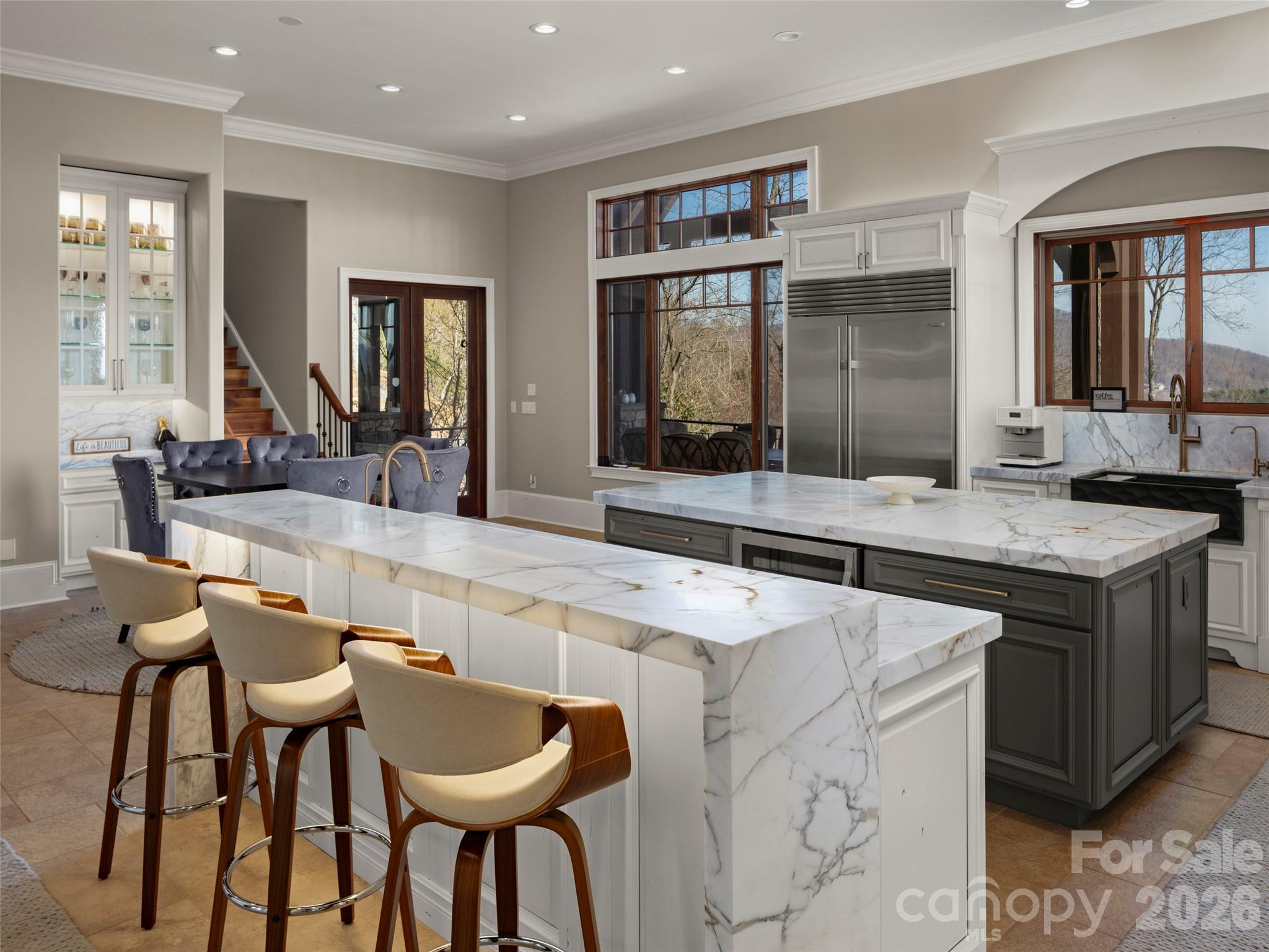 kitchen bar with natural translucence that allows light to pass through the stone and highlight its unique veining and depth - 47 Ridge Pine Trail, Arden
