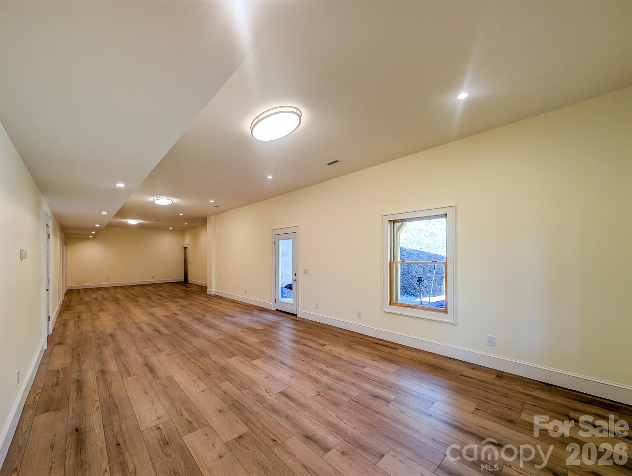 Fully Finished Downstairs offers flexible spacious room that would be ideal for Media, Recreation & More! Includes Outdoor Access, Under the Stairs Storage, Spacious Bedroom with private en-suite bathroom & More - 338 Majestic Mountain Drive, Burnsville