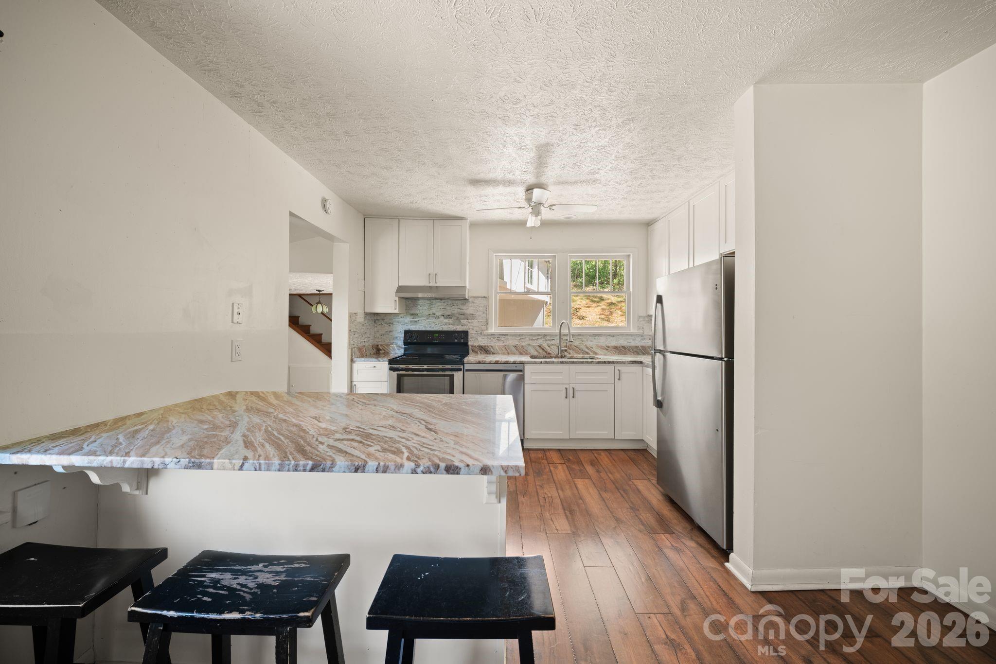 Main house kitchen with granite countertops - 290 Hookers Gap Road, Candler