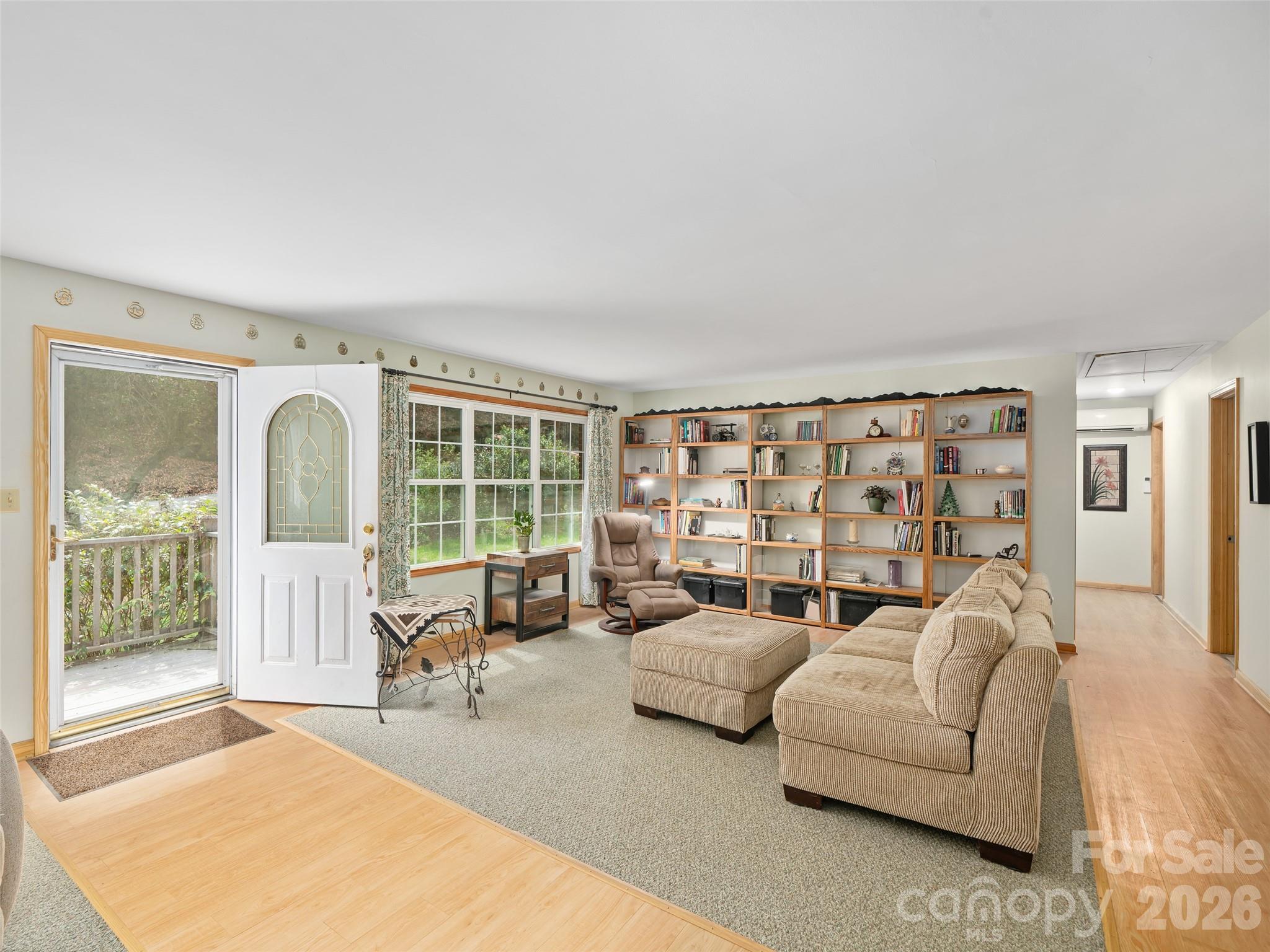 Moveable bookshelves in living room area - 3829 Coxes Creek Road, Burnsville