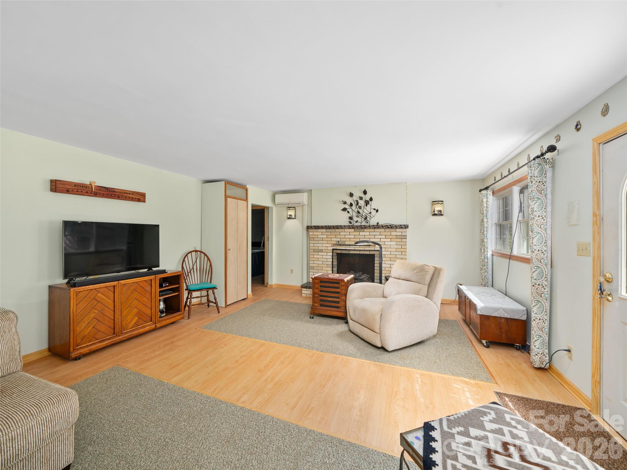 Living room centers the split floor plan - 3829 Coxes Creek Road, Burnsville