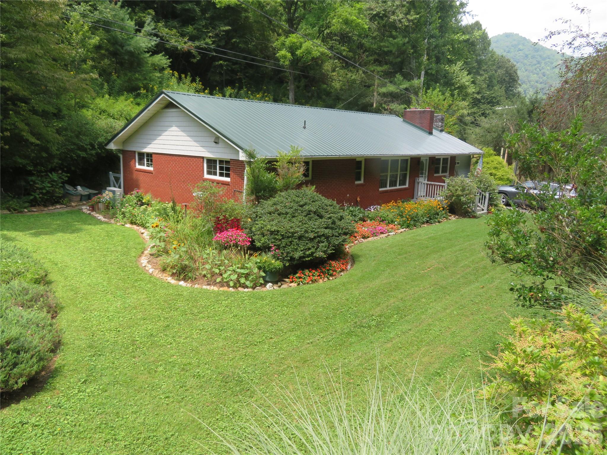 One level living, 4 Bedrooms and 2 Full Baths Renovated Brick home on 10 acres with creek, well and spring - 3829 Coxes Creek Road, Burnsville