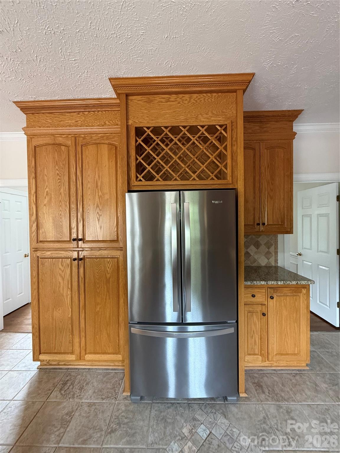 Kitchen with left side double door pantry style cabinets with roll-outs - 8219 Deer Drive, Harrisburg
