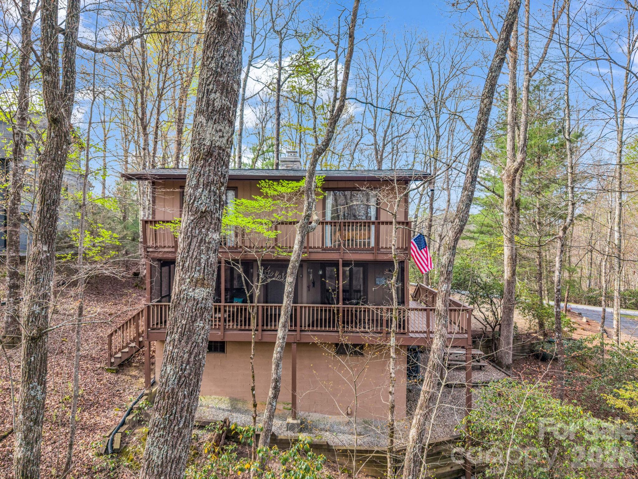 Back of home showing open deck and screened in porch - 78 Wahuhu Court, Brevard