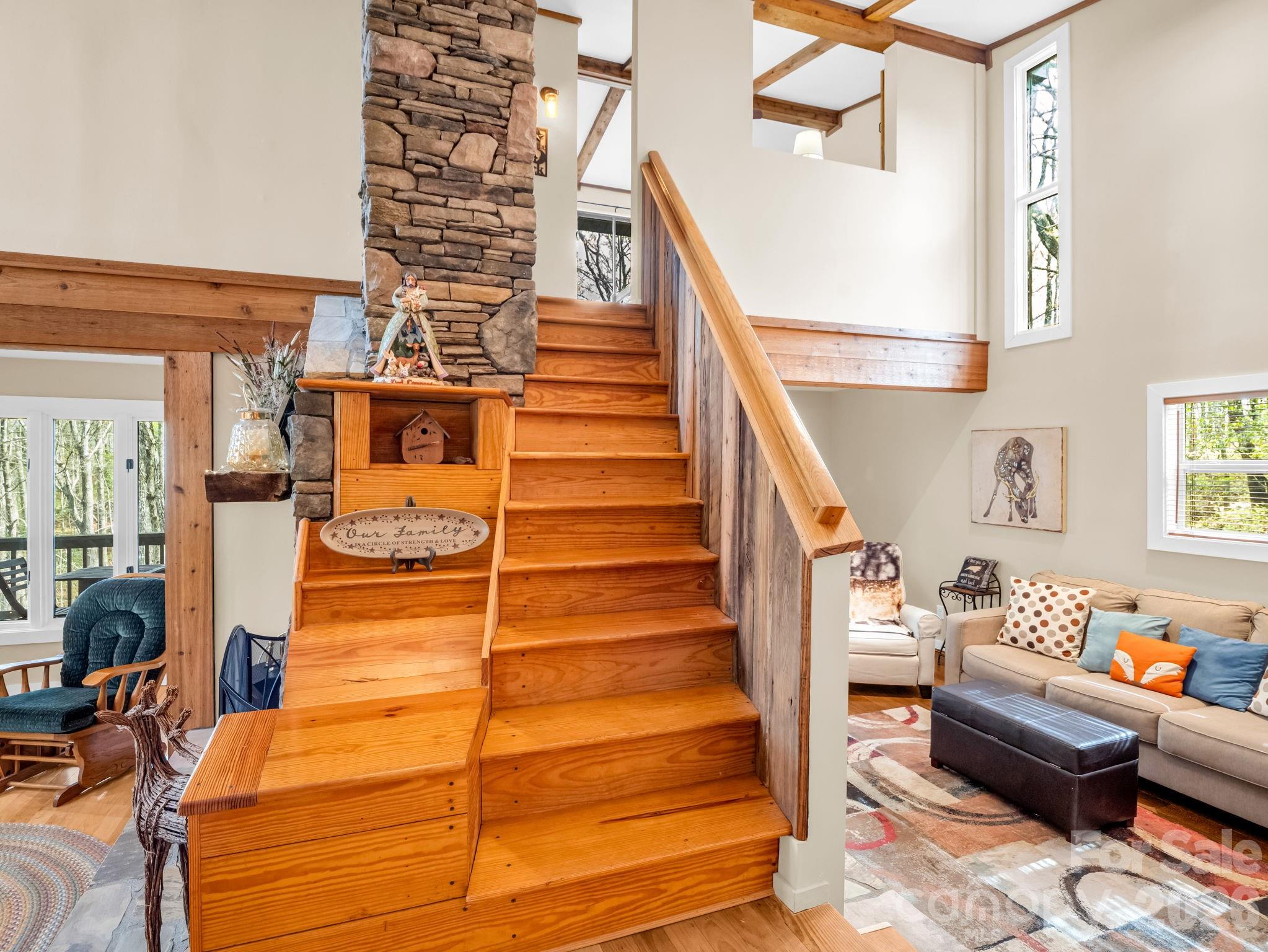 Main level view showing stairs to upstairs and family room to the left - 78 Wahuhu Court, Brevard