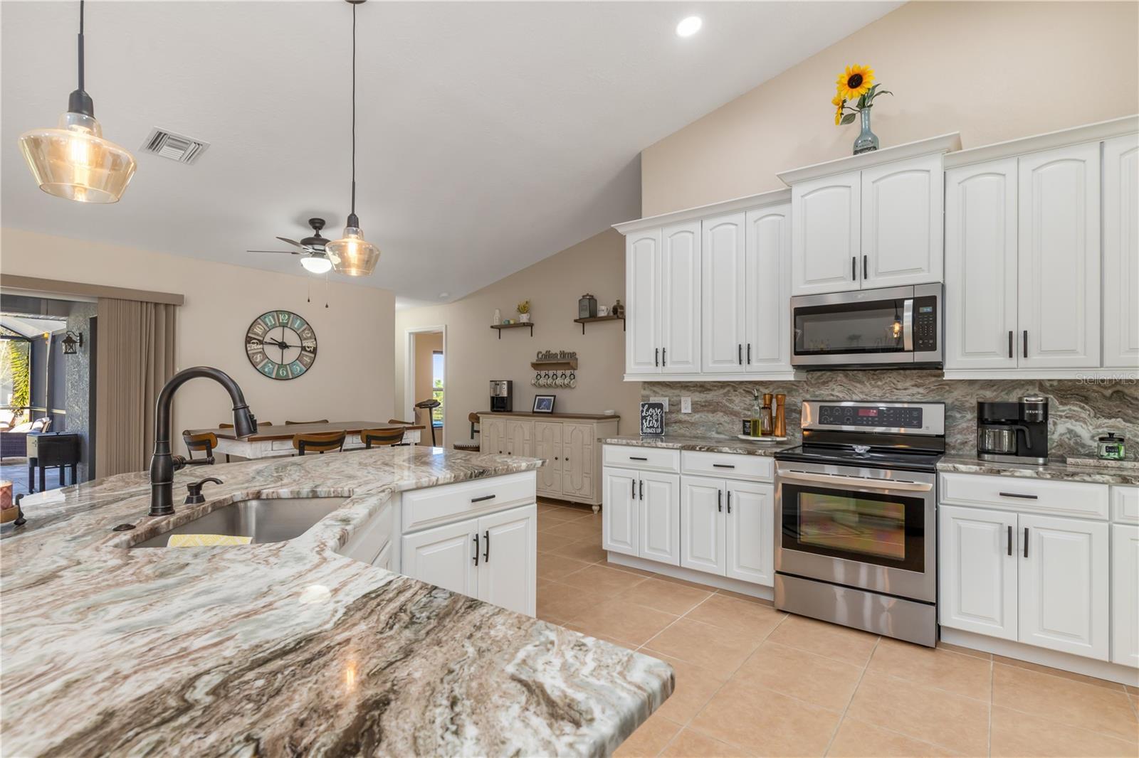 Completely Remodeled Kitchen with Granite Countertops and Backsplash - 8251 ARLEWOOD CIR, PORT CHARLOTTE