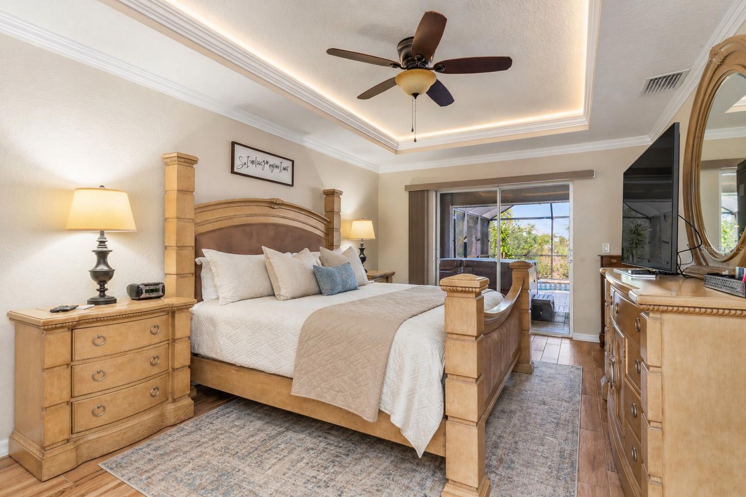 Primary Bedroom with Lanai Access Sliders - 8251 ARLEWOOD CIR, PORT CHARLOTTE