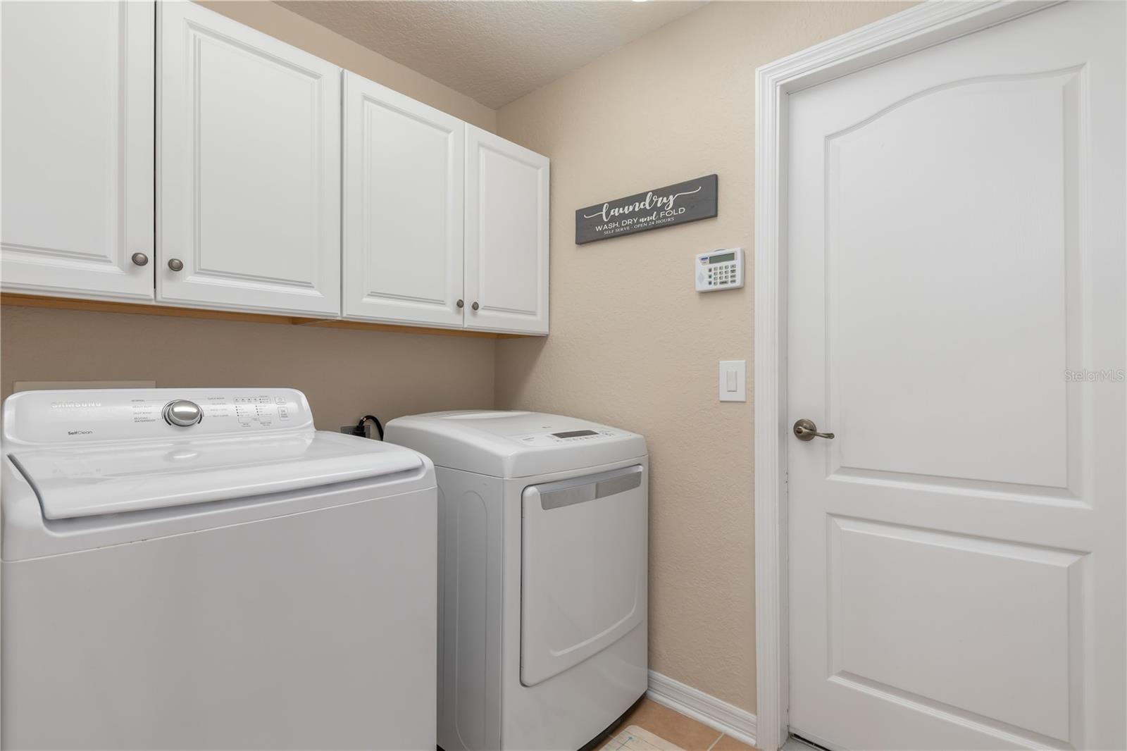 Laundry Room/Storage Cabinets - Garage Access - 8251 ARLEWOOD CIR, PORT CHARLOTTE