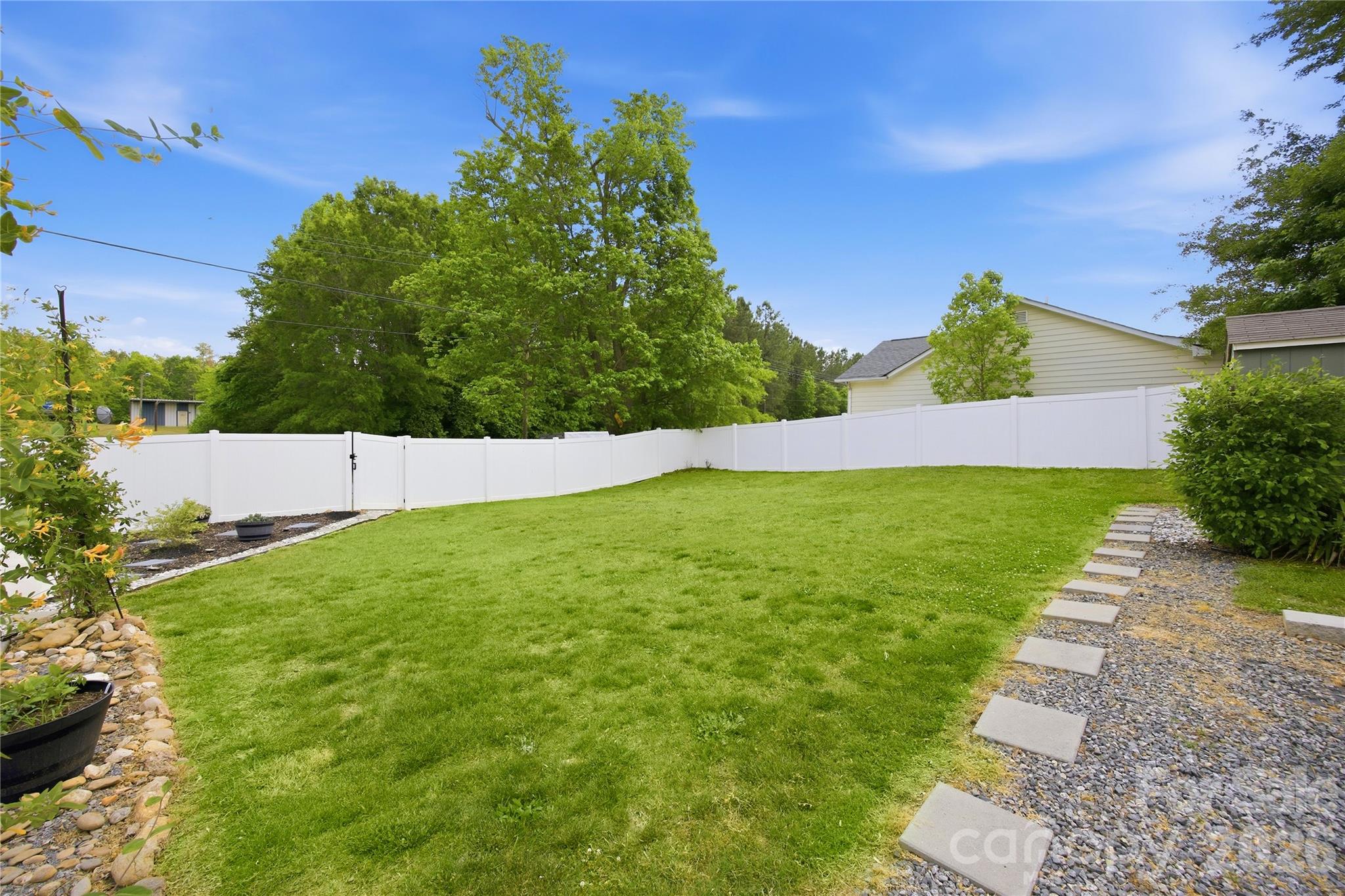 White Vinyl Privacy fencing in the back - 1108 Skyland Street, Kannapolis
