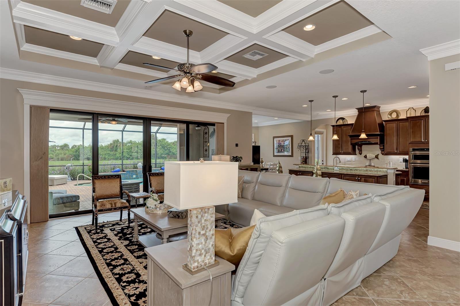 Hand designed and built beamed ceiling- master crafted by Fine-Line Carpentry - High end, custom lighting and fans throughout the home. - 10965 BULLRUSH DR, VENICE