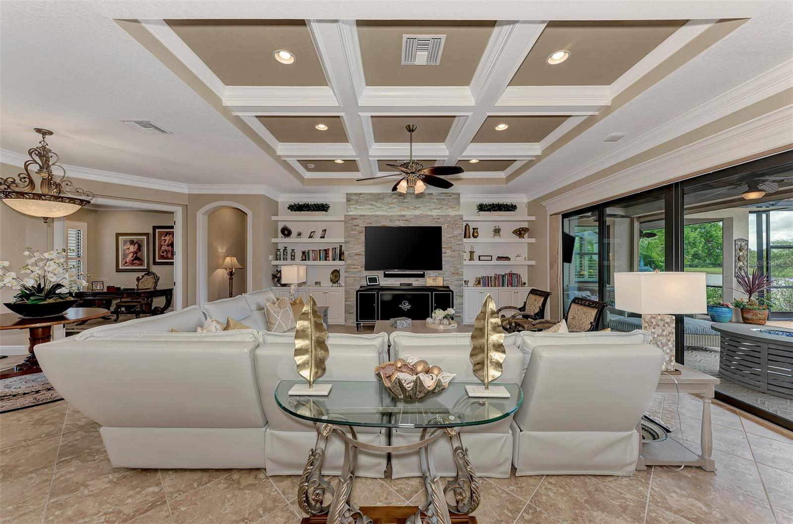 Hand designed and built beamed ceiling- master crafted by Fine-Line Carpentry - High end custom lighting and fans throughout the home. - 10965 BULLRUSH DR, VENICE