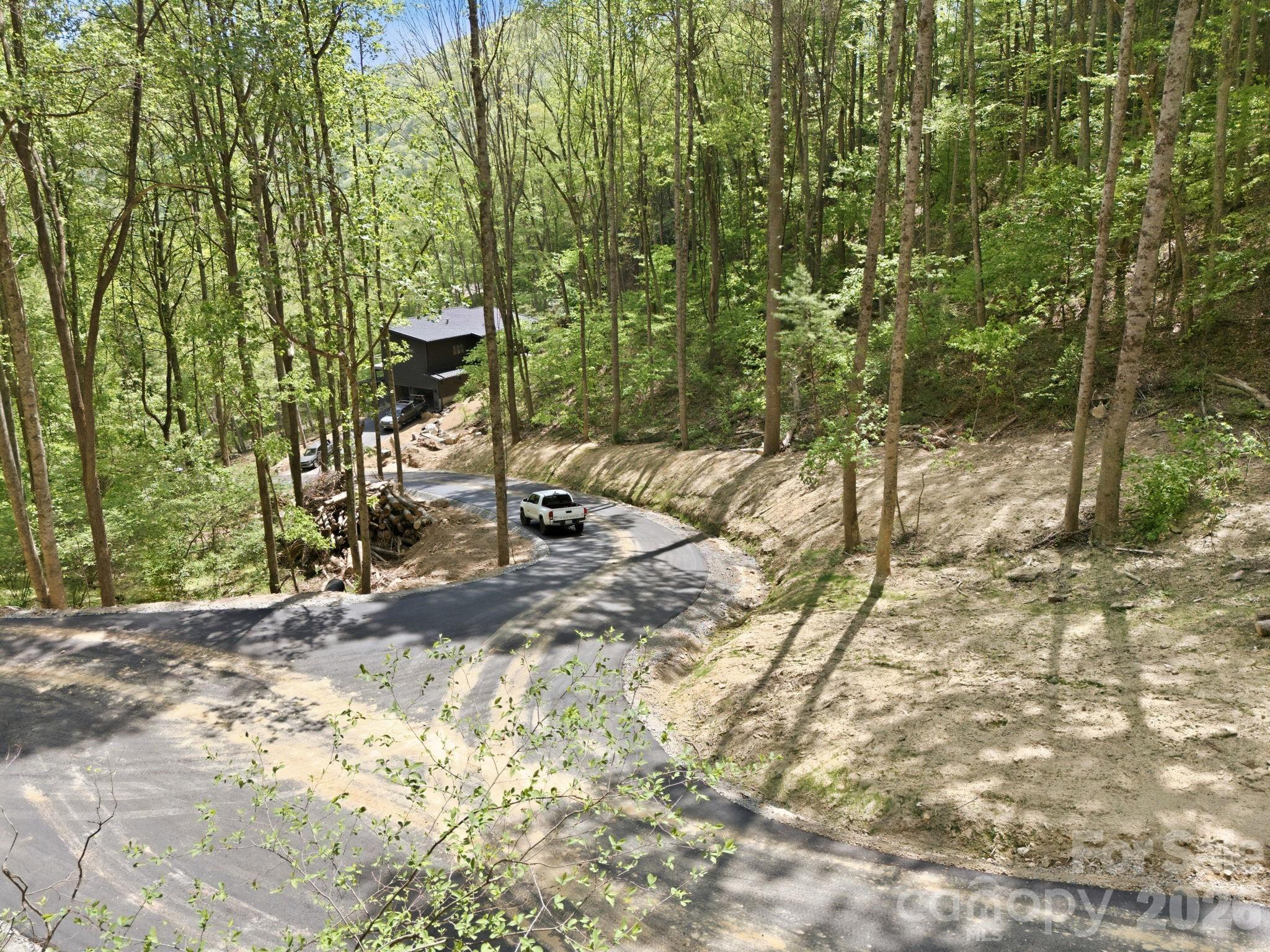 Drive down from the lot. The home seen is the neighboring home, not within eyesight of the lot. Built by the same builder. - 122 Running Deer Lane, Mars Hill
