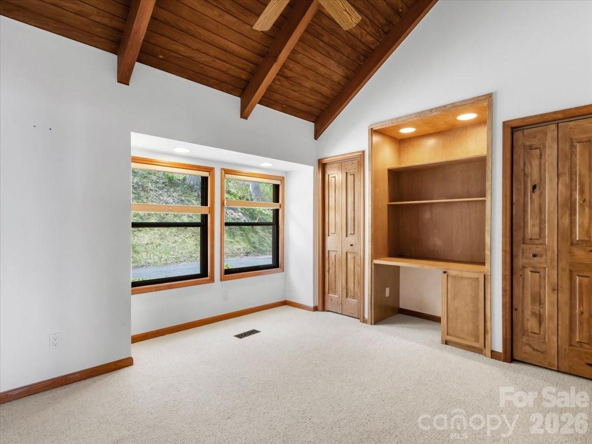 Main level bedroom with built-ins and carpet - 49 Slickrock Ridge Way S, Burnsville