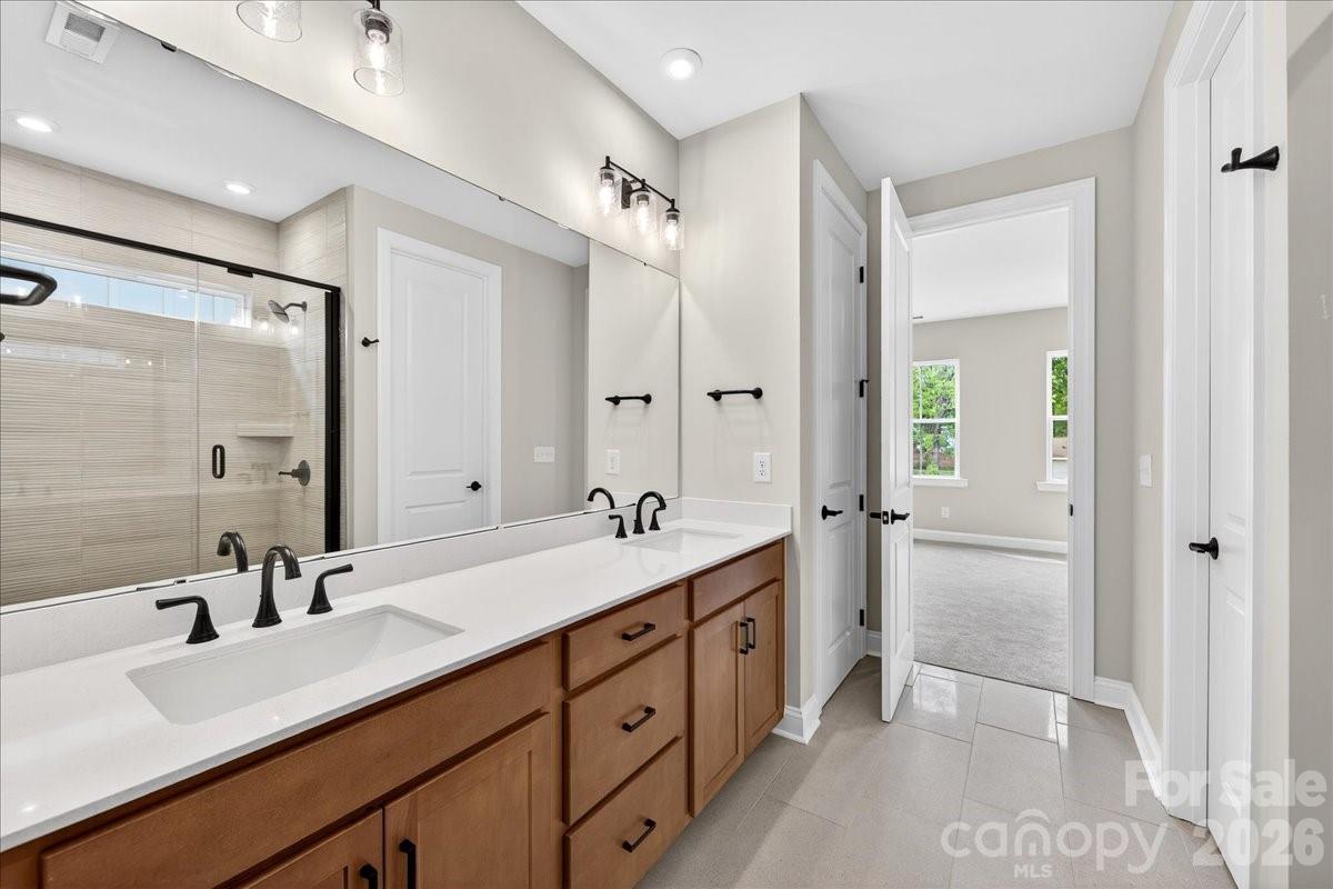 Light filled primary bathroom - 420 Old Town Village Road, Waxhaw